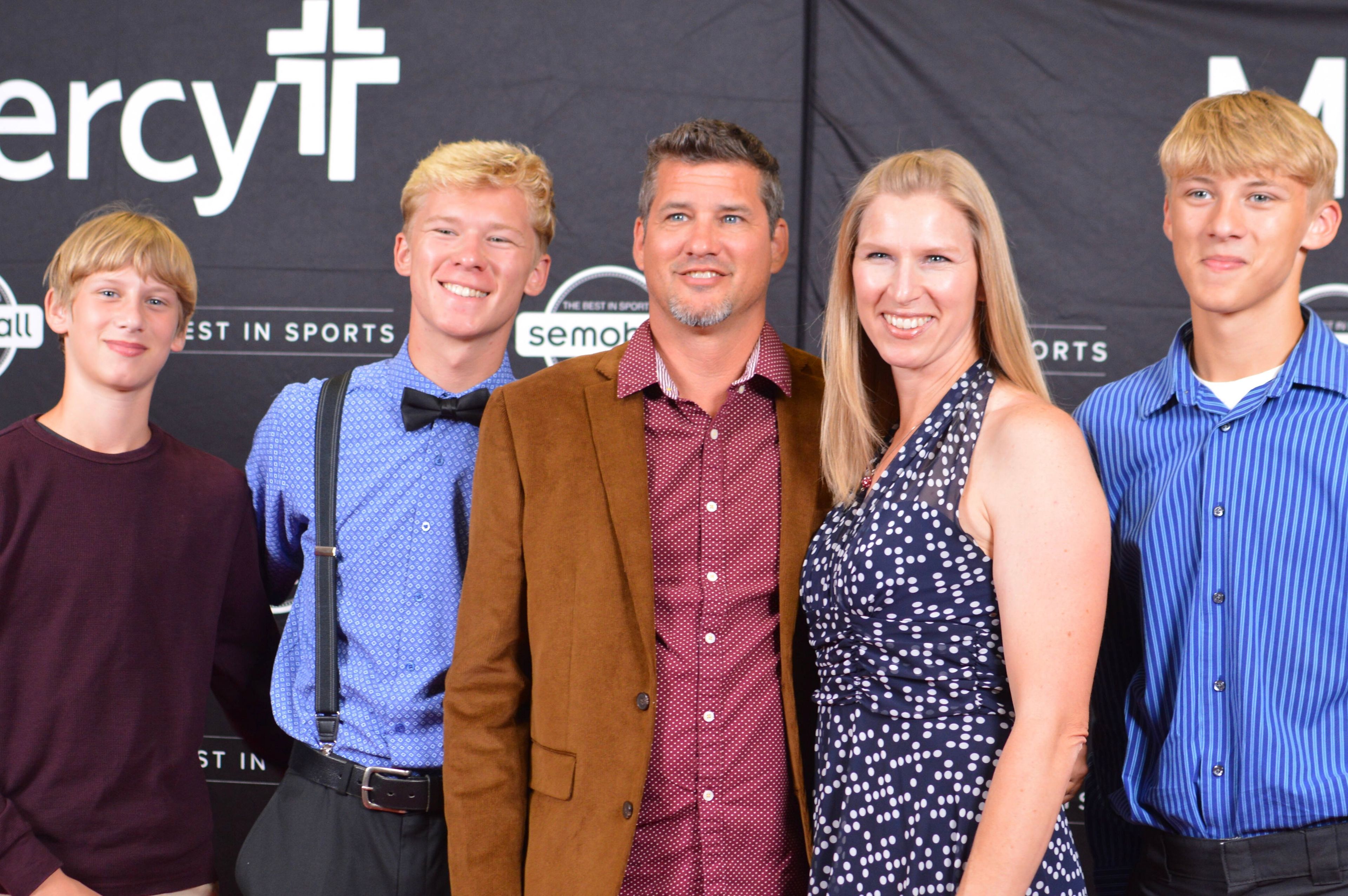 The Layton family on the red carpet during the 2024 Semoball Awards, sponsored by Mercy, on Friday, July 12, at La Croix Church in Cape Girardeau. Ryan Layton, center, was named Coach of the Year for leading the Woodland High School cross country teams to the Class 2 state championships. His oldest son, Woodland graduating senior Reed Layton, second from left, won the Male Cross Country Athlete of the Year.