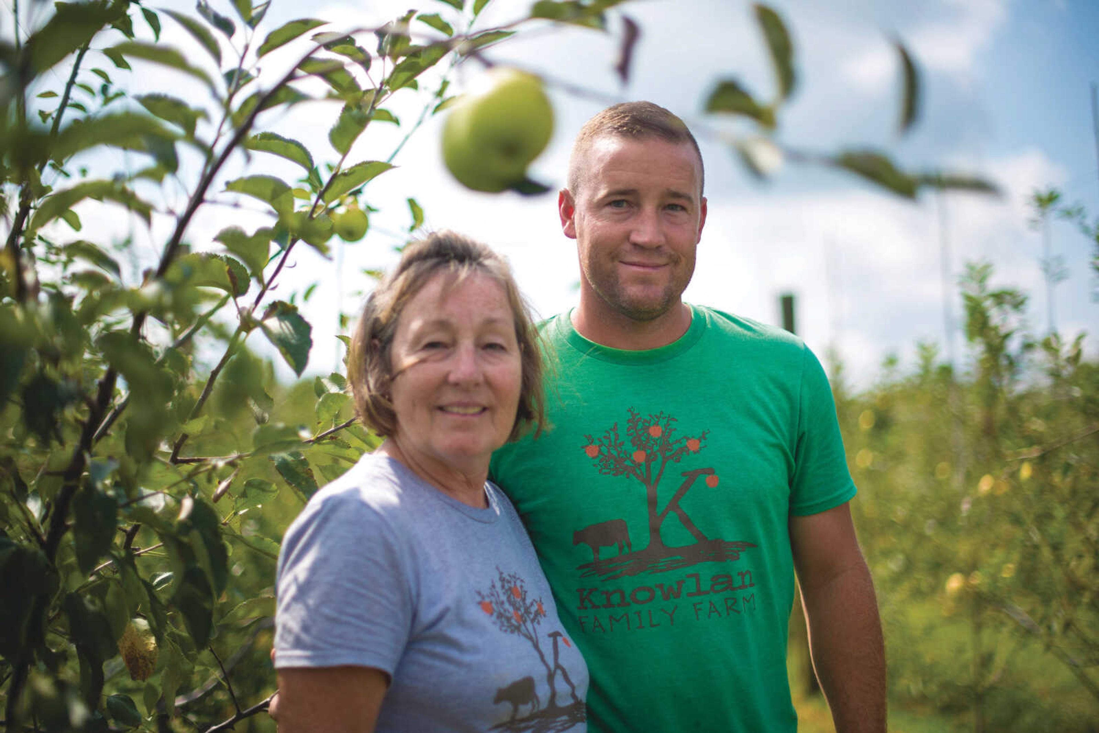 Headline Bold:Bonnie Knowlan and her son Spencer Knowlan pose for a photo in their apple orchard at Knowlan Family Farm Wednesday, Sept. 20, 2017 in Burfordville.