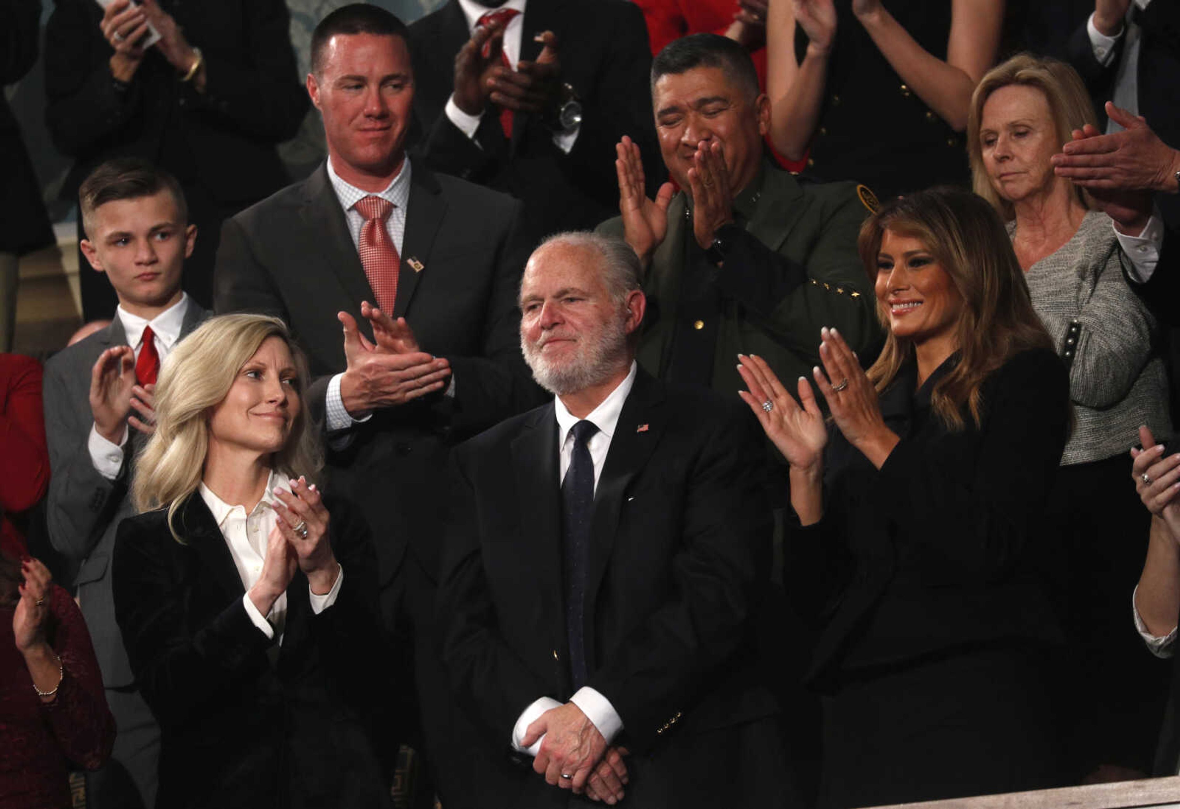 Rush Limbaugh reacts as first Lady Melania Trump and his wife, Kathryn, applaud as President Donald Trump delivers his State of the Union address to a joint session of Congress on Feb. 4, 2020, on Capitol Hill in Washington.