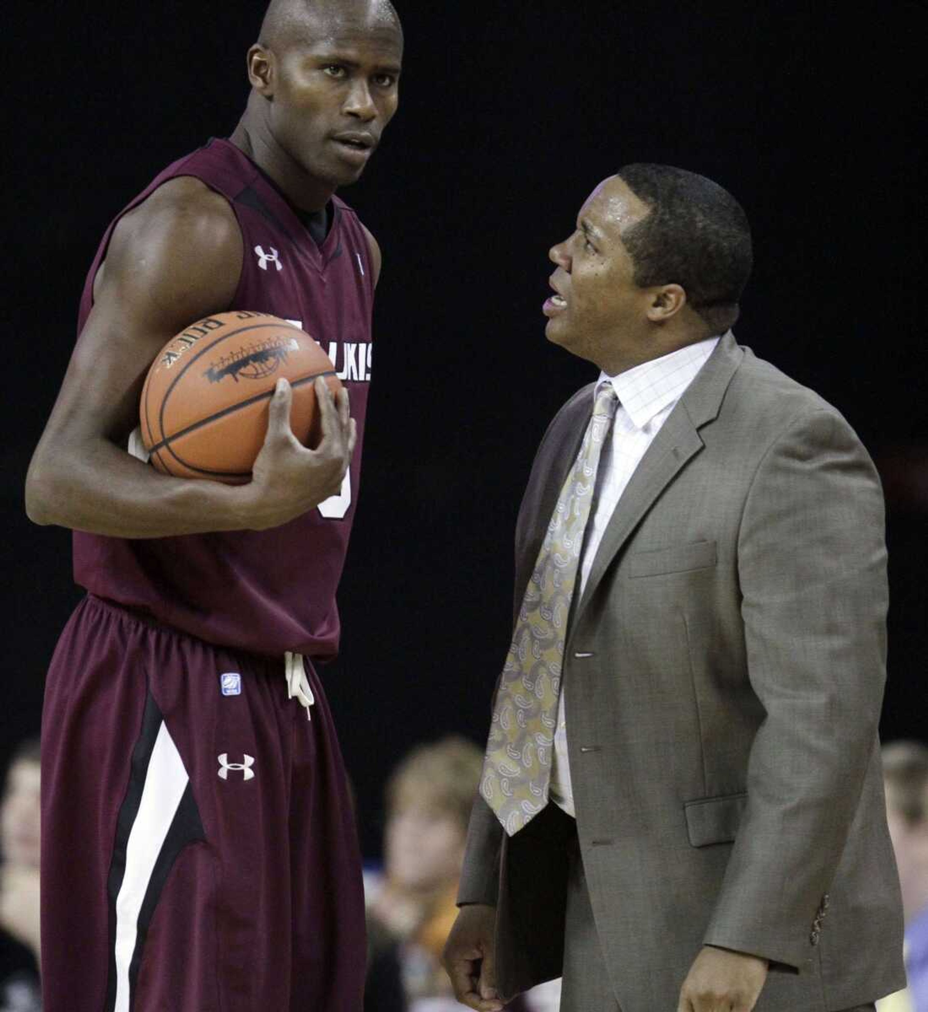 Southern Illinois coach Chris Lowery talks to Mamadou Seck during a game against Purdue at the Chicago Invitational last month in Hoffman Estates, Ill. (Nam Y. Huh ~ Associated Press)