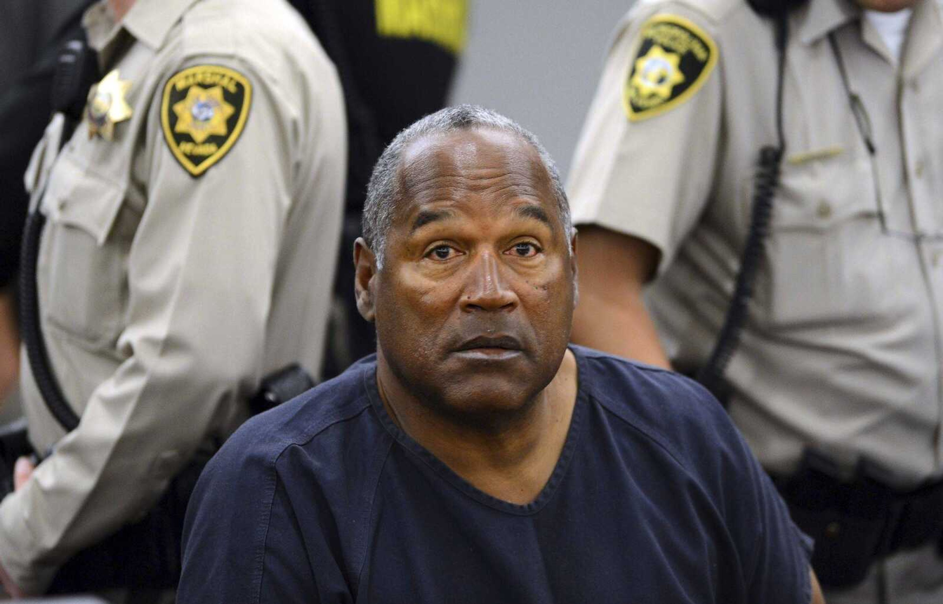 O.J. Simpson sits during a break  of an evidentiary hearing in 2013 in Clark County District Court in Las Vegas. Simpson, the former football star, TV pitchman and now Nevada prison inmate, will have a lot going for him when he appears before state parole board members Thursday seeking his release after more than eight years for an ill-fated bid to retrieve sports memorabilia.