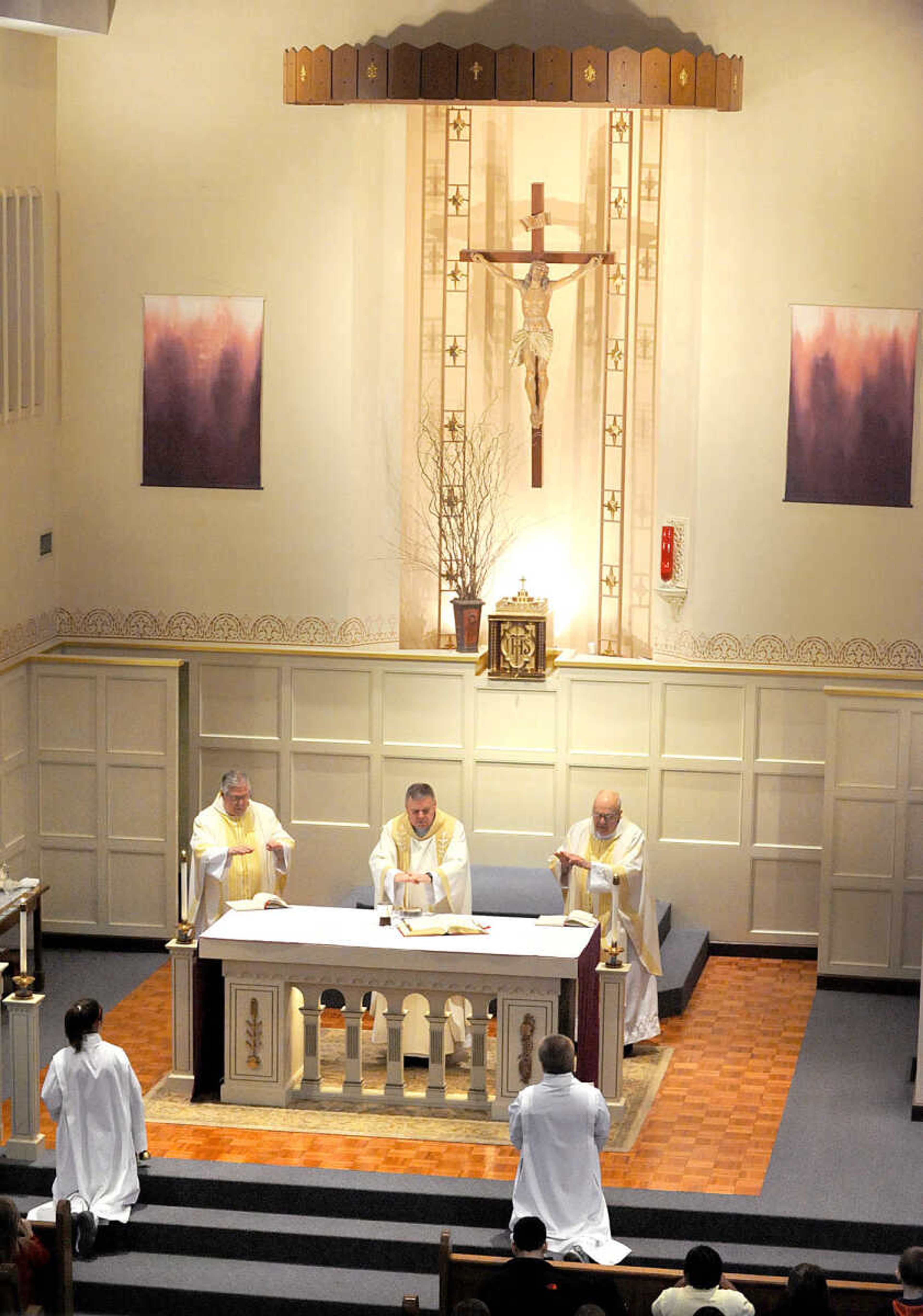 LAURA SIMON ~ lsimon@semissourian.com
Rev. Normand Varone, left, Rev. Tom Kiefer, center, and Msgr. William Stanton bless the offerings Friday morning, March 15, 2013 during the Mass of Thanksgiving at St. Mary's Cathedral in Cape Girardeau. The mass was in honor of the election of Pope Francis I.