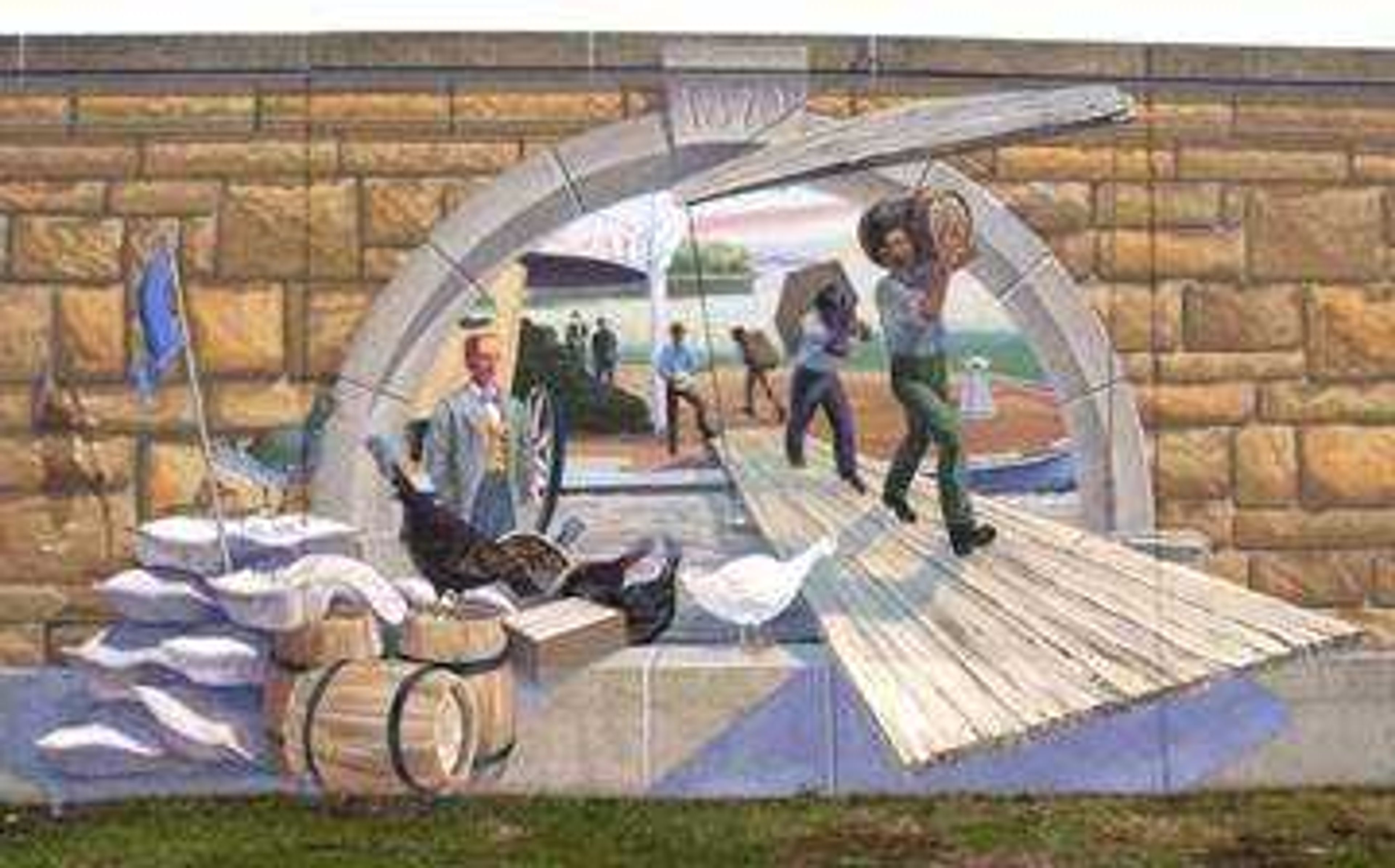 This mural depicts the height of riverboat commerce in the 1880s and shows men unloading a riverboat docked at Cape Girardeau. The men hauling barrels and sacks are supposed to be roustabouts, the longshoremen of the steamboat era. These roustabouts are carrying grain off the riverboat -- grain that likely was destined for George Thilenius' flour mill on Broadway. In addition to Thilenius' mill, there were three other mills in Cape Girardeau circa 1880.