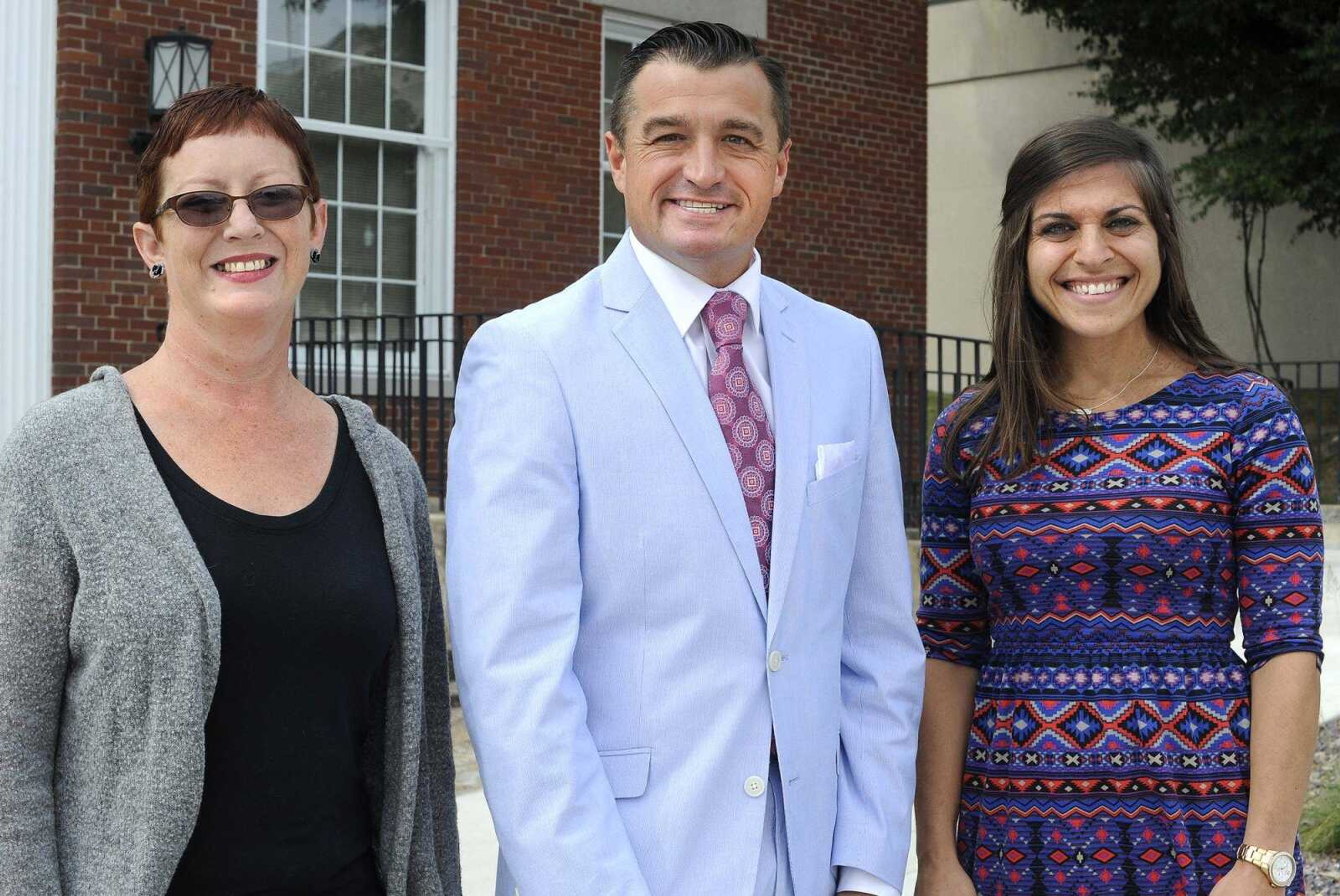 Jackson Area Chamber of Commerce executive director Brian Gerau, center, executive assistant Rosa Green, left, and membership director Jen Berti pose for a photo Friday in Jackson.