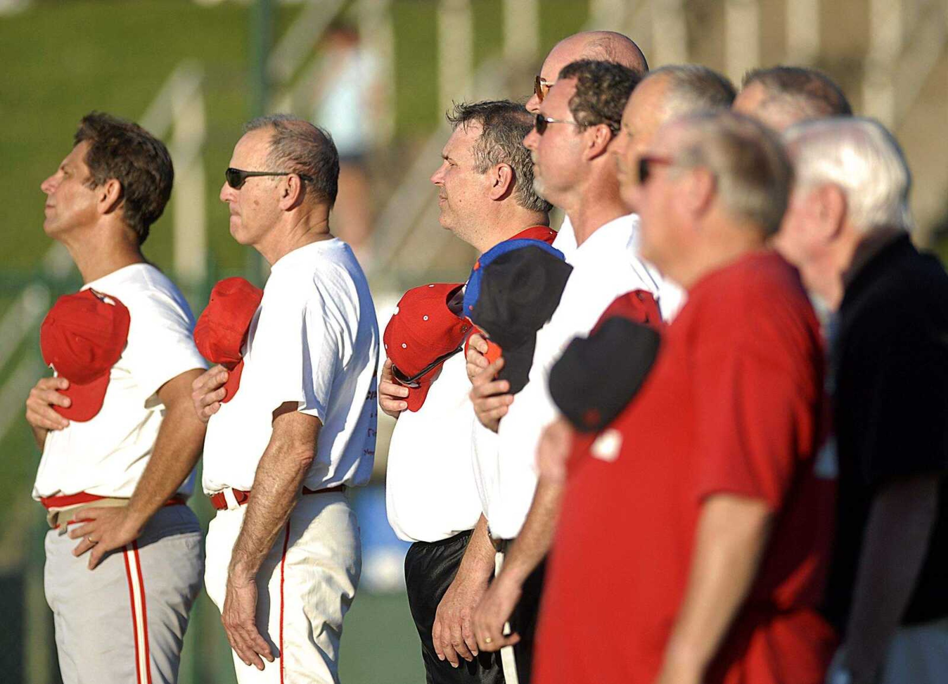 AARON EISENHAUER ~ aeisenhauer@semissourian.com
The "old timers" stand during the national anthem before the start of the Capahas Old Timers Game on Saturday, June 14, 2008.