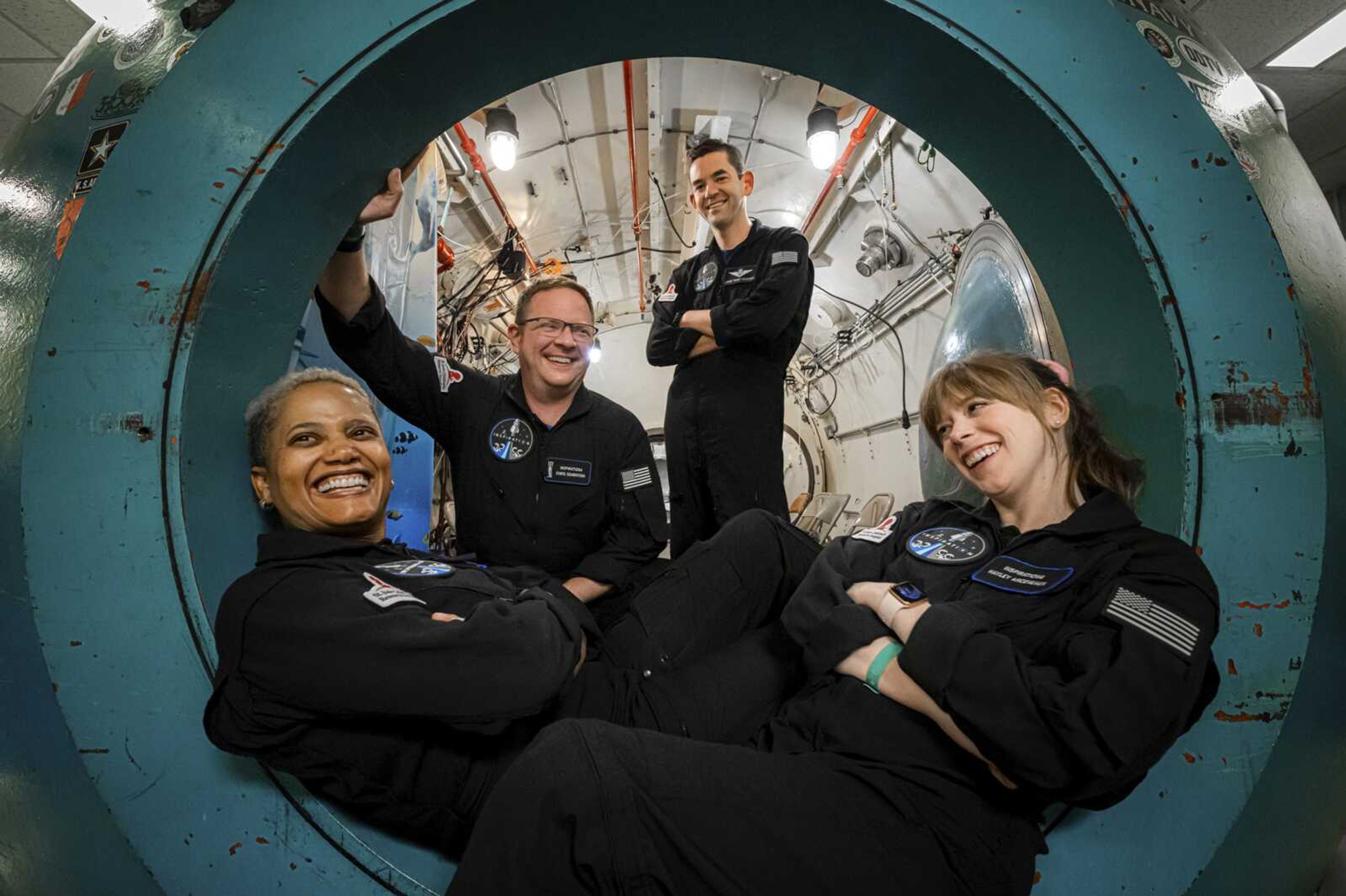 In this July 2 photo, from left, Sian Proctor, Chris Sembroski, Jared Isaacman and Hayley Arceneaux pose for a photo at Duke Health in Durham, North Carolina, during hypoxia training to understand how each crew member reacts in a low-oxygen environment.