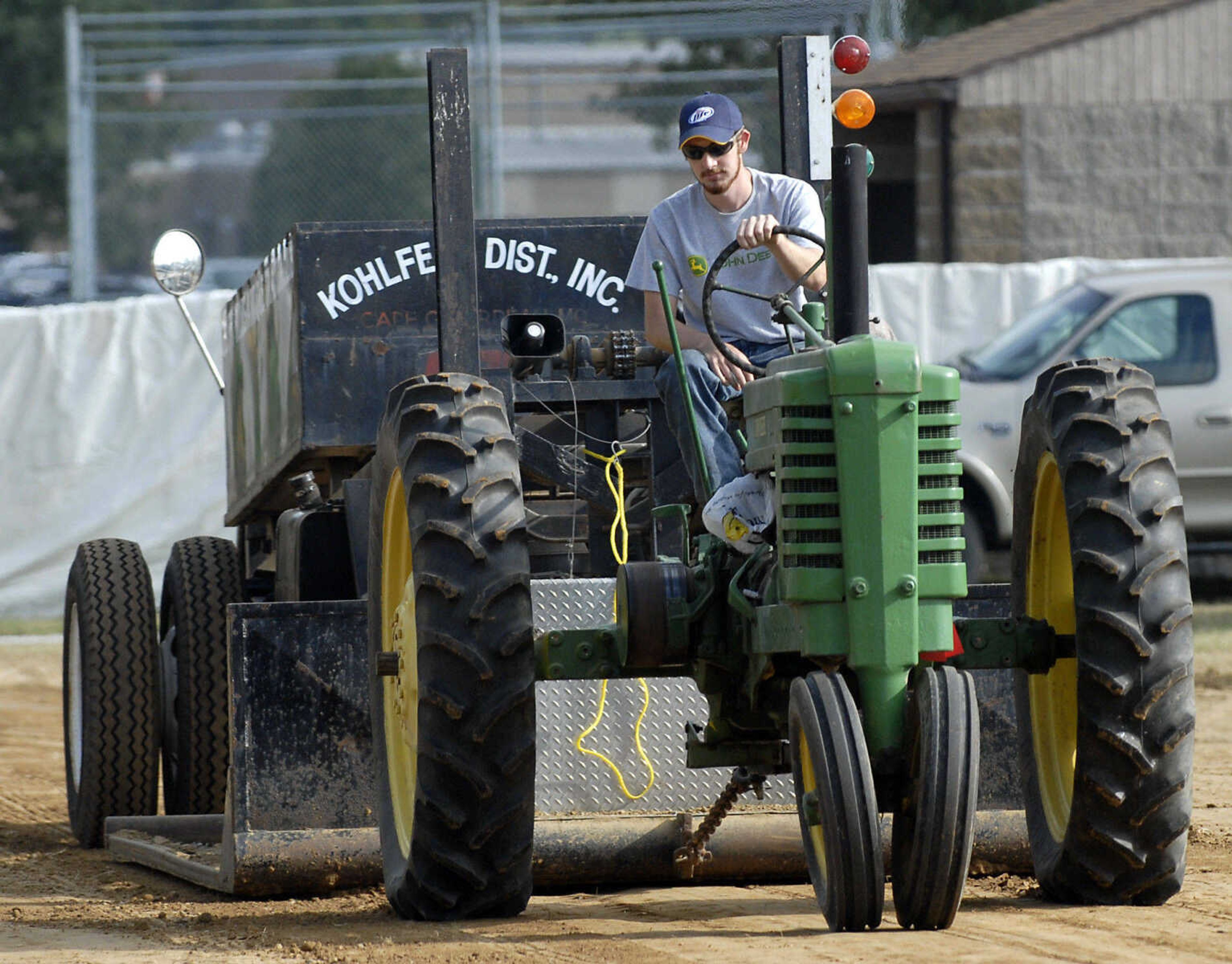 KRISTIN EBERTS ~ keberts@semissourian.com

Adam Kirchhoff drives his 1939 John Deere model B tractor during the antique tractor pull put on by the Egypt Mills Antique Tractor Club at the SEMO District Fair on Saturday, Sept. 10, 2011.