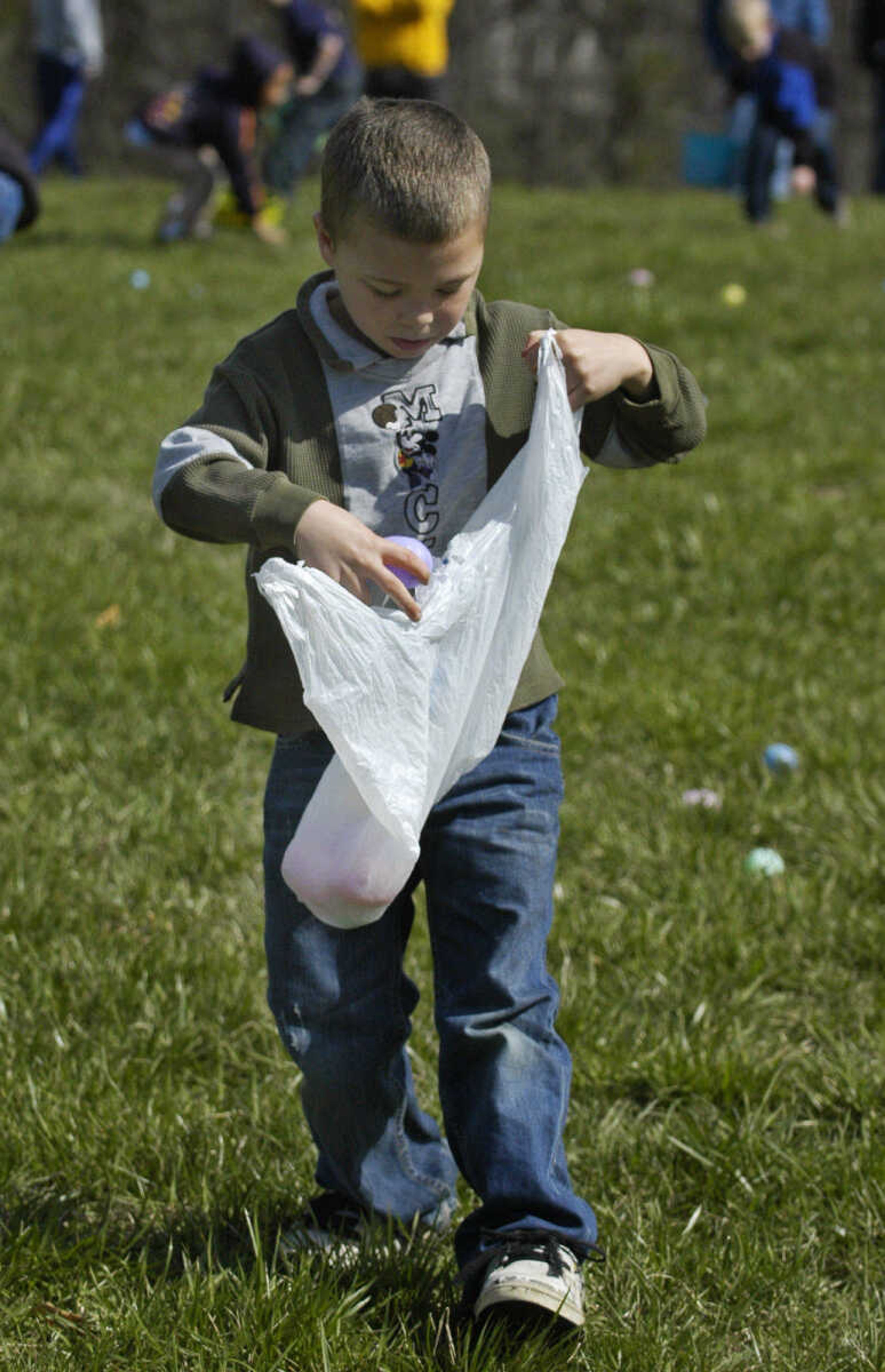 KRISTIN EBERTS ~ keberts@semissourian.com

Ryan Criddle, 8, collects eggs during the Cape Girardeau Parks and Recreation easter egg hunt at Kiwanis Park in Cape Girardeau, Mo., on Saturday, March 27, 2010.