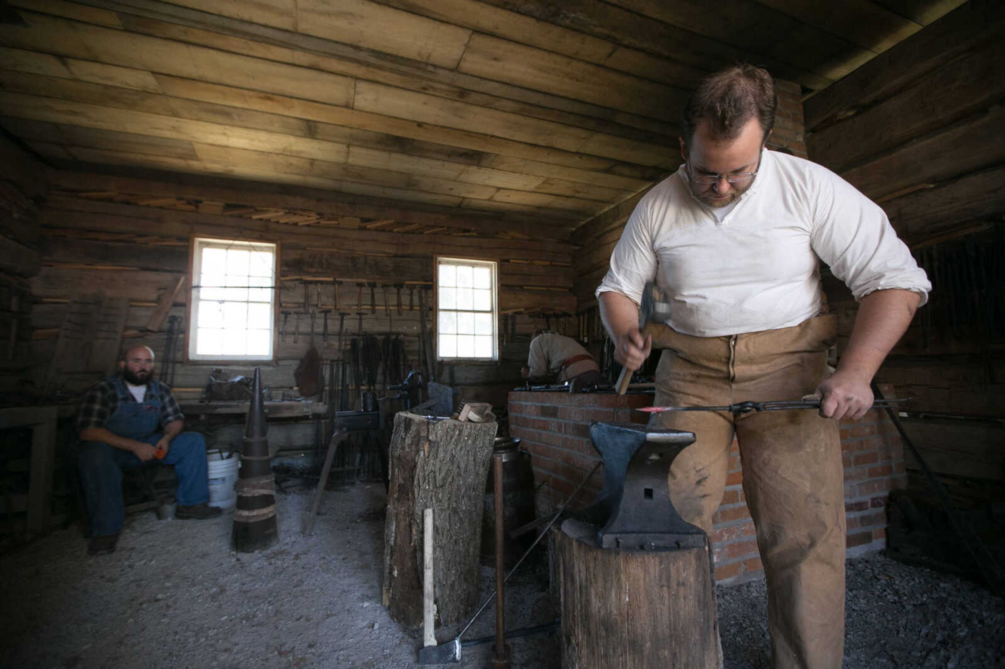 GLENN LANDBERG ~ glandberg@semissourian.com

Ian Wille uses a hammer to fashion a square nail in the blacksmith demonstration area of the Fall Festival at the Saxon Lutheran Memorial in Frohna, Missouri, Saturday, Oct. 10, 2015.