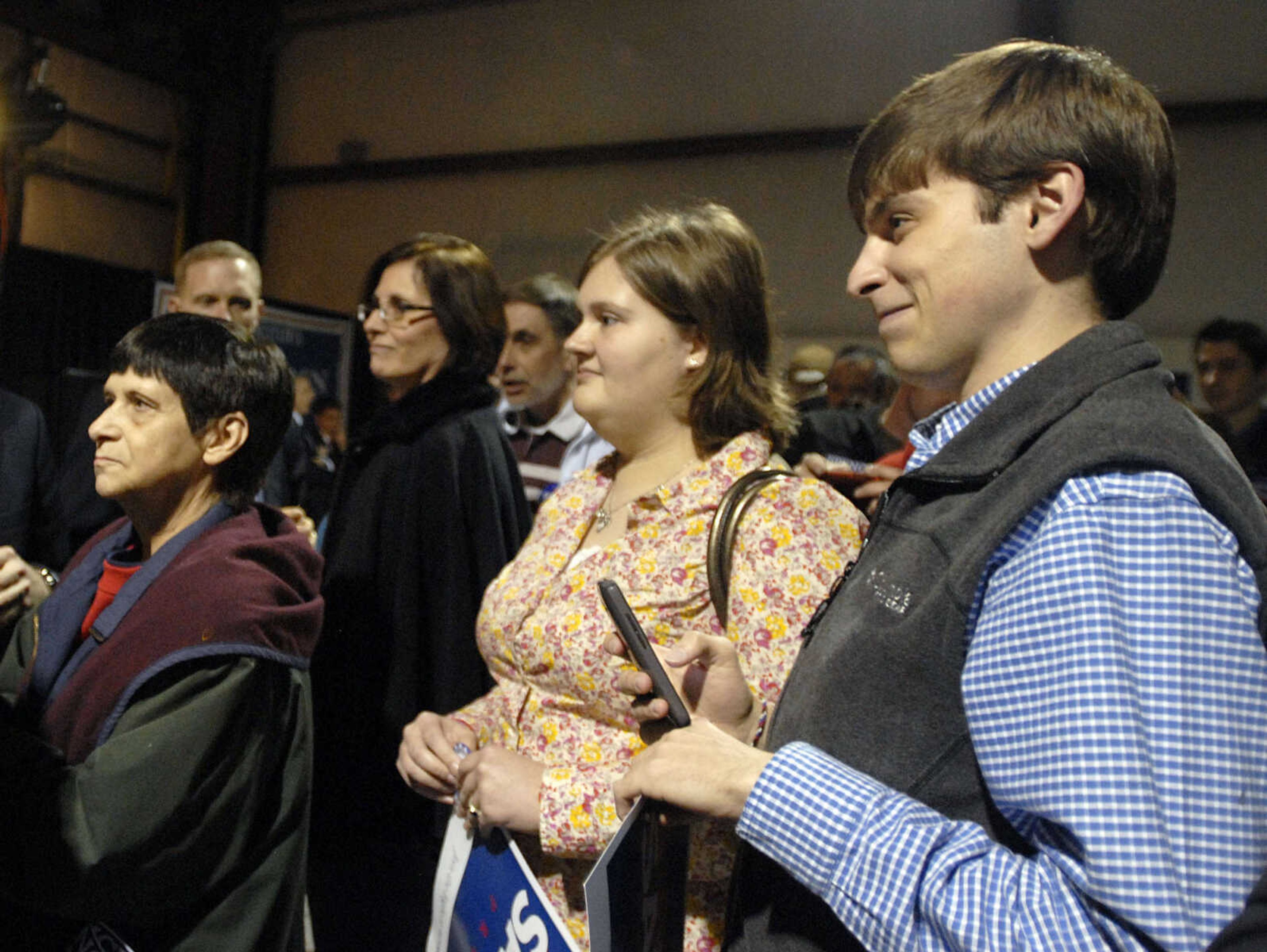 LAURA SIMON ~ lsimon@semissourian.com
Supporters of Republican presidential candidate Rick Santorum wait for an autograph Saturday night, March 10, 2012 during his campaign stop at the Cape Girardeau Regional Airport.