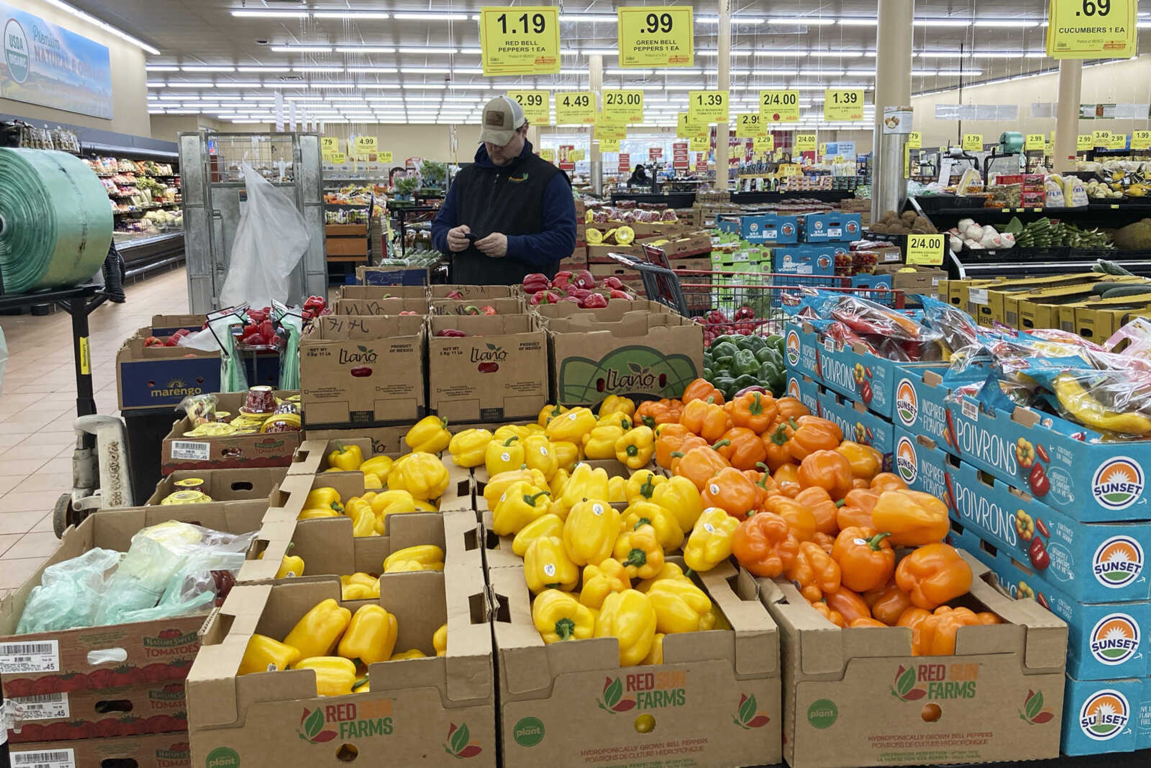 A man shops at a grocery store March 19 in Buffalo Grove, Illinois. As household expenses outpace earnings, many people are expressing concern about their financial futures.