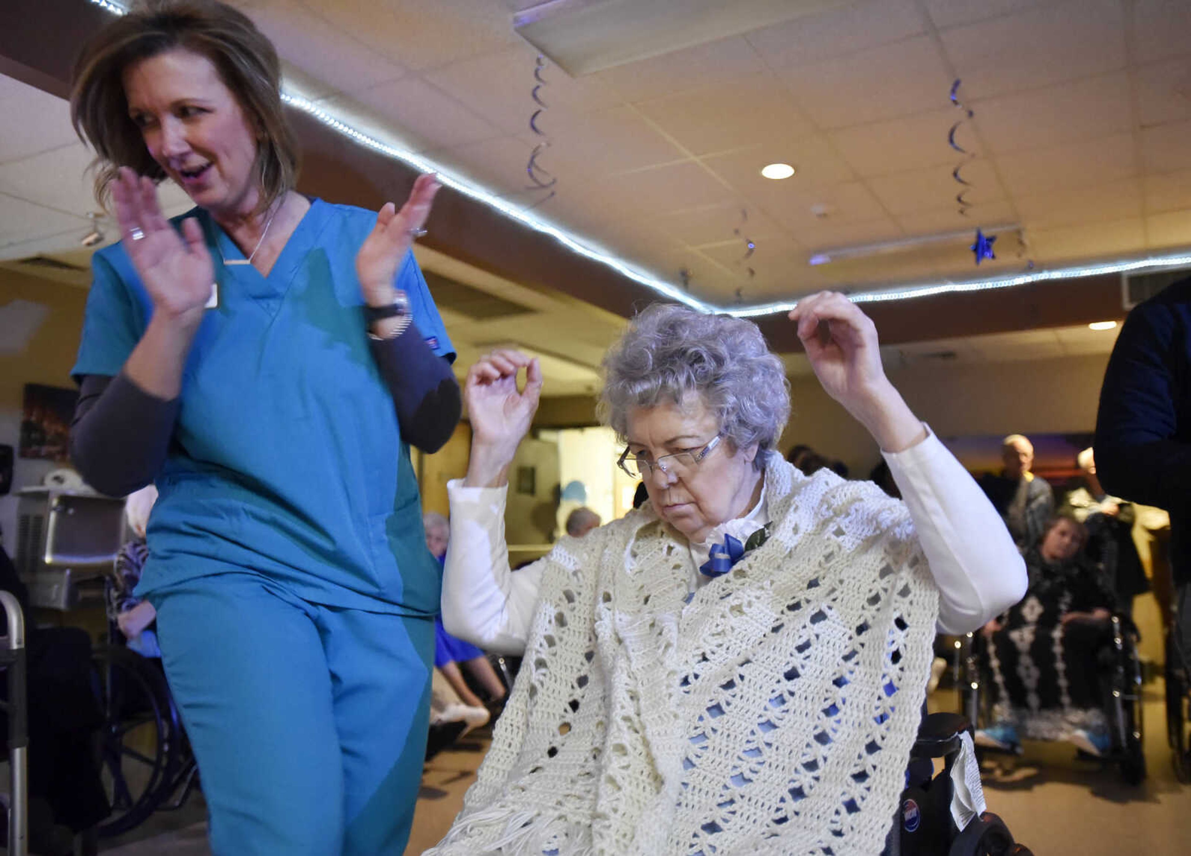 Monti Callow, left, and Connie Gibson dance to The Isley Brothers "Shout!" during the "Celebration of Life" winter ball on Tuesday, Jan. 9, 2017, at Ratliff Care Center in Cape Girardeau.