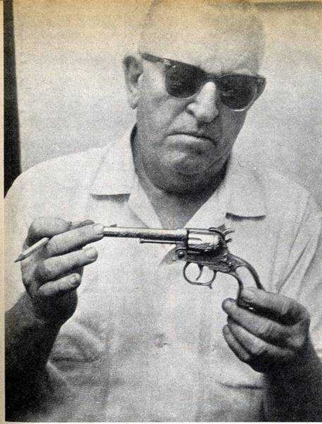 Southeast Missourian file 
Chief Percy Little examined a toy gun that might have been used to stop Bonnie Huffman's car the night that she was murdered in July 1954.