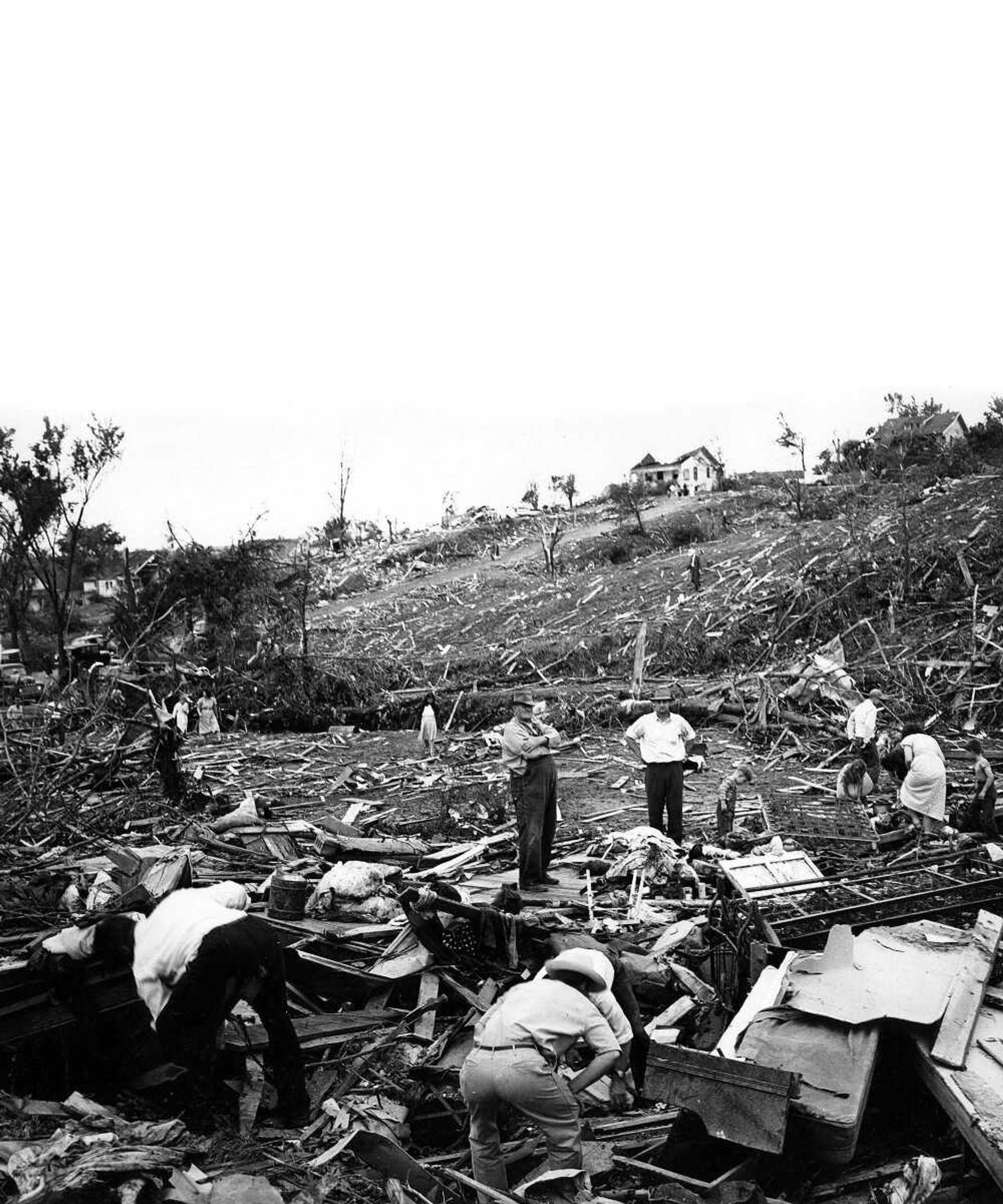 Searching for a few precious possessions after the tornado hit Cape Girardeau on May 21, 1949, these residents of the Rand, Johnson and Water streets area in the east side of the Red Star suburb toiled over the ruins of years of saving. This was the general area in which eight persons lost their lives.