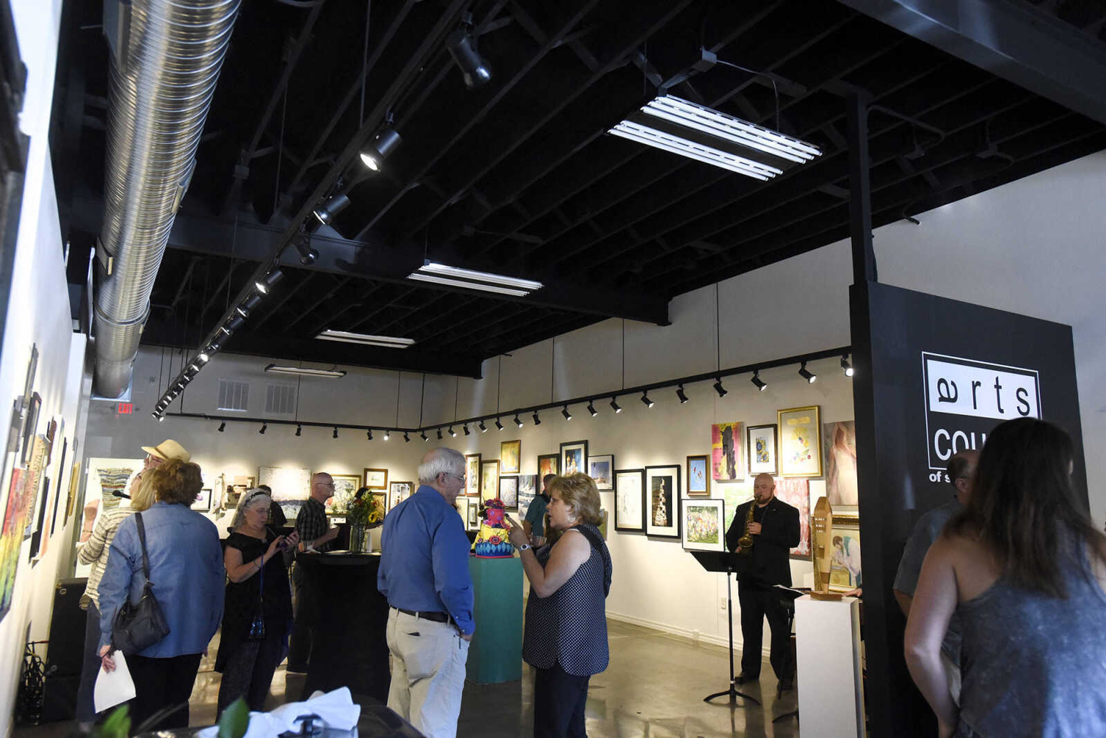 LAURA SIMON ~ lsimon@semissourian.com

People take in the grand opening reception for the 4th annual Members Exhibit at the Arts Council of Southeast Missouri in its new location at 16 North Spanish Street in downtown Cape Girardeau on Friday, Sept. 2, 2016.