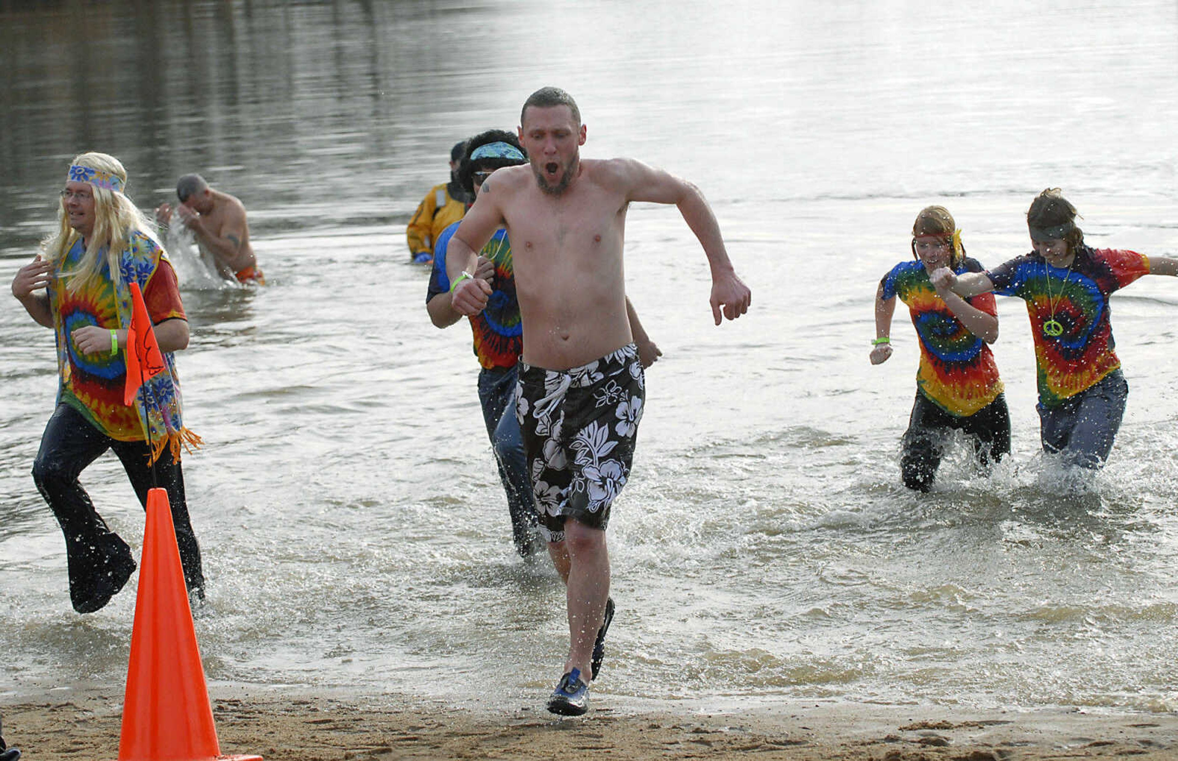 KRISTIN EBERTS ~ keberts@semissourian.com

Plungers head back to the beach during the 2012 Polar Plunge at the Trail of Tears State Park's Lake Boutin on Saturday, Feb. 4, 2012.