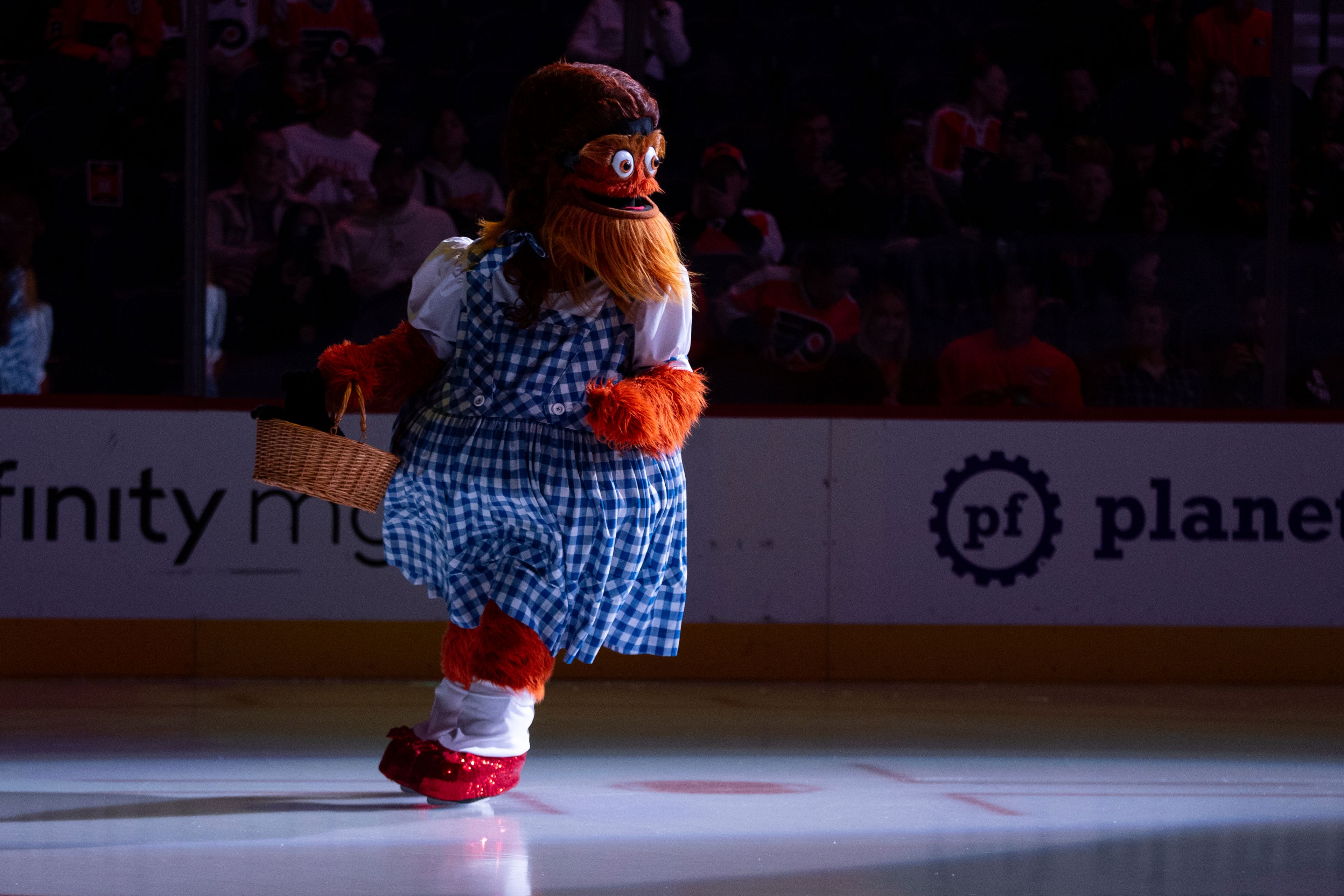 Philadelphia Flyers mascot Gritty comes out as Dorothy from "The Wizard of Oz" ahead of the first period of an NHL hockey game against the St Louis Blues, Thursday, Oct. 31, 2024, in Philadelphia. (AP Photo/Chris Szagola)