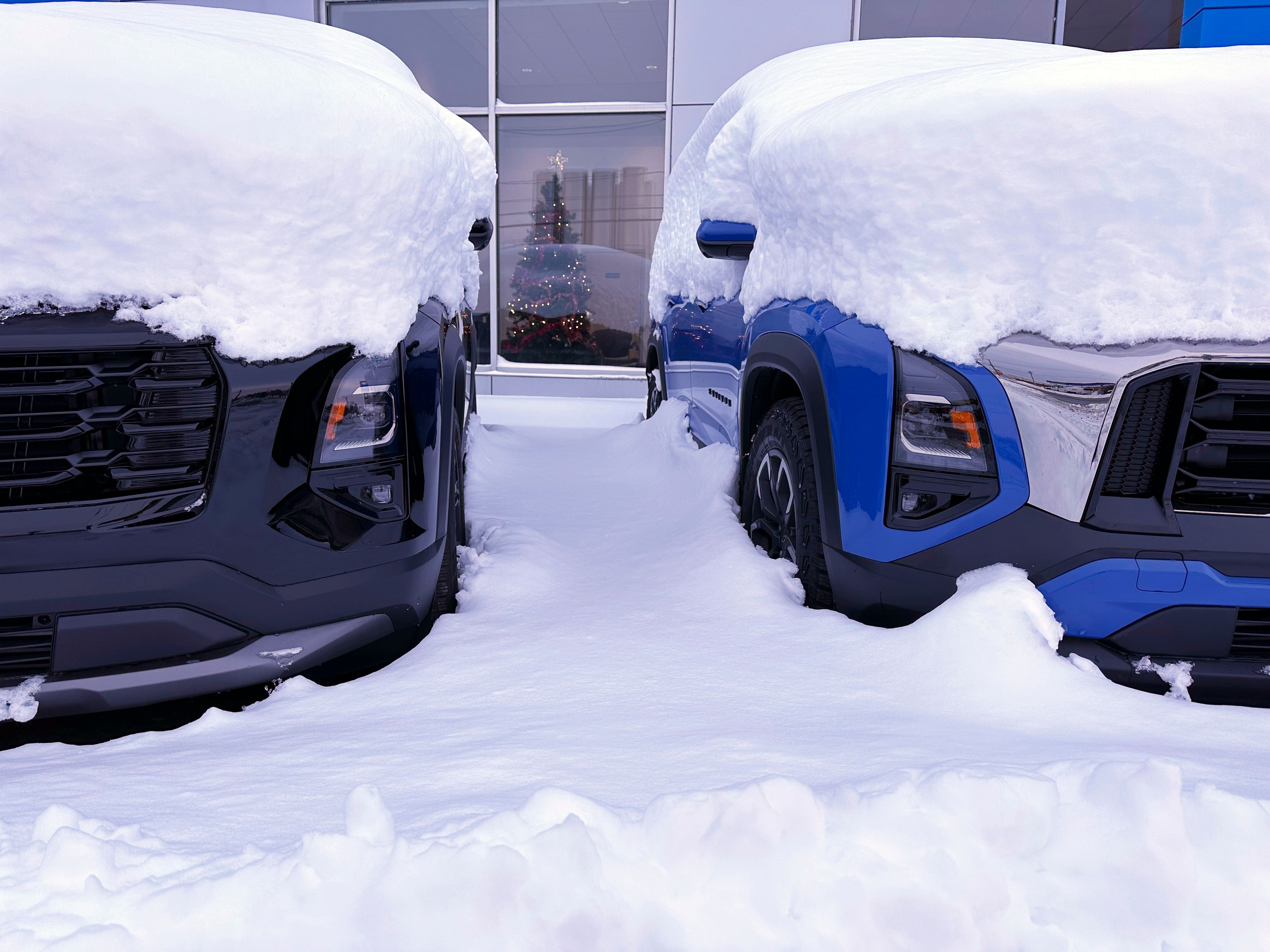 Vehicles are covered during a snow storm in Lowville, N.Y., on Sunday Dec, 1, 2024. (AP Photo/Cara Anna)