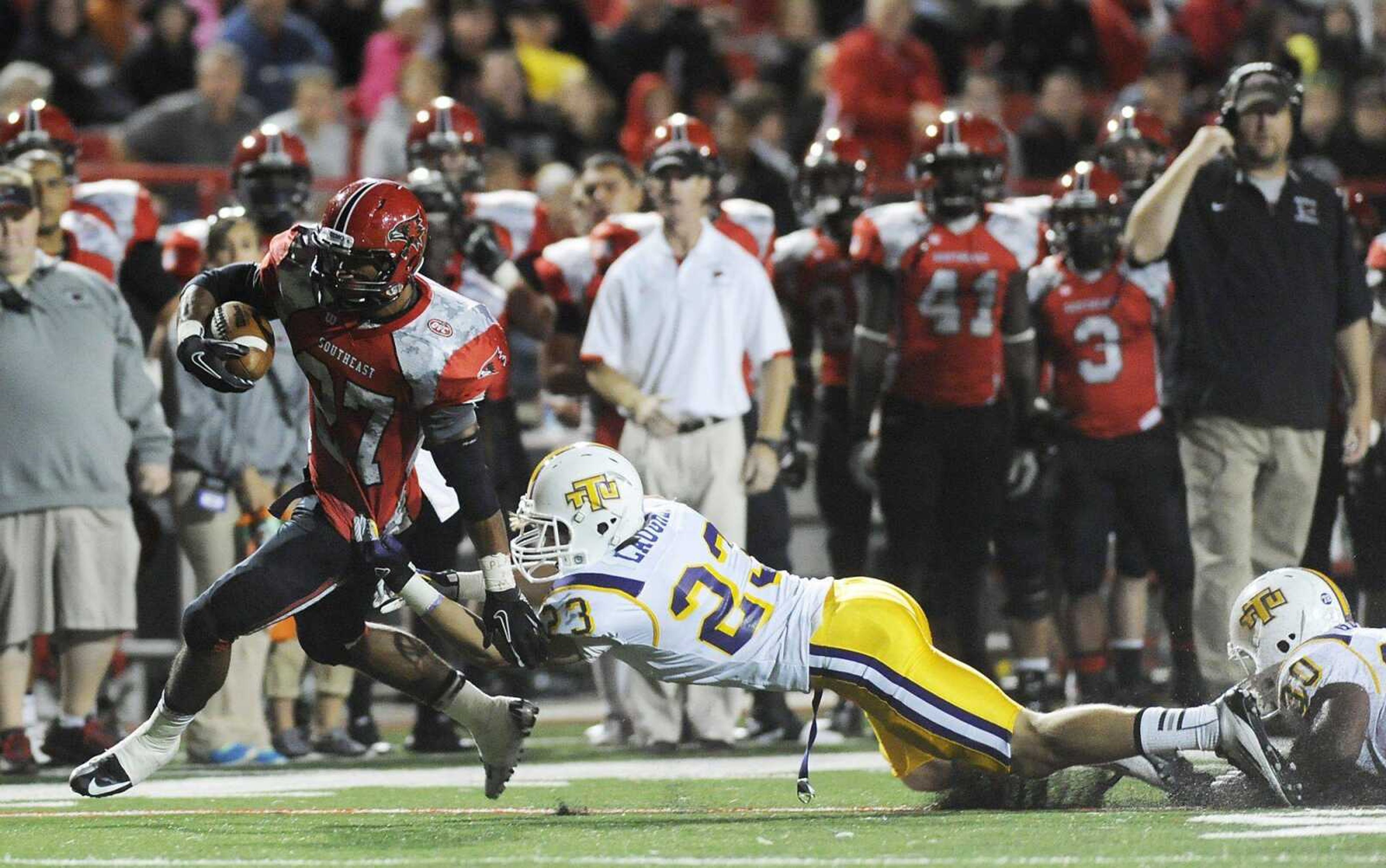 Southeast Missouri State running back Levi Terrell breaks free from Tennessee Tech safety Jimmy Laughlin in the fourth quarter of the Redhawks' 41-38 double overtime win over the Eagles Saturday, September 22, at Houck Stadium. (ADAM VOGLER)