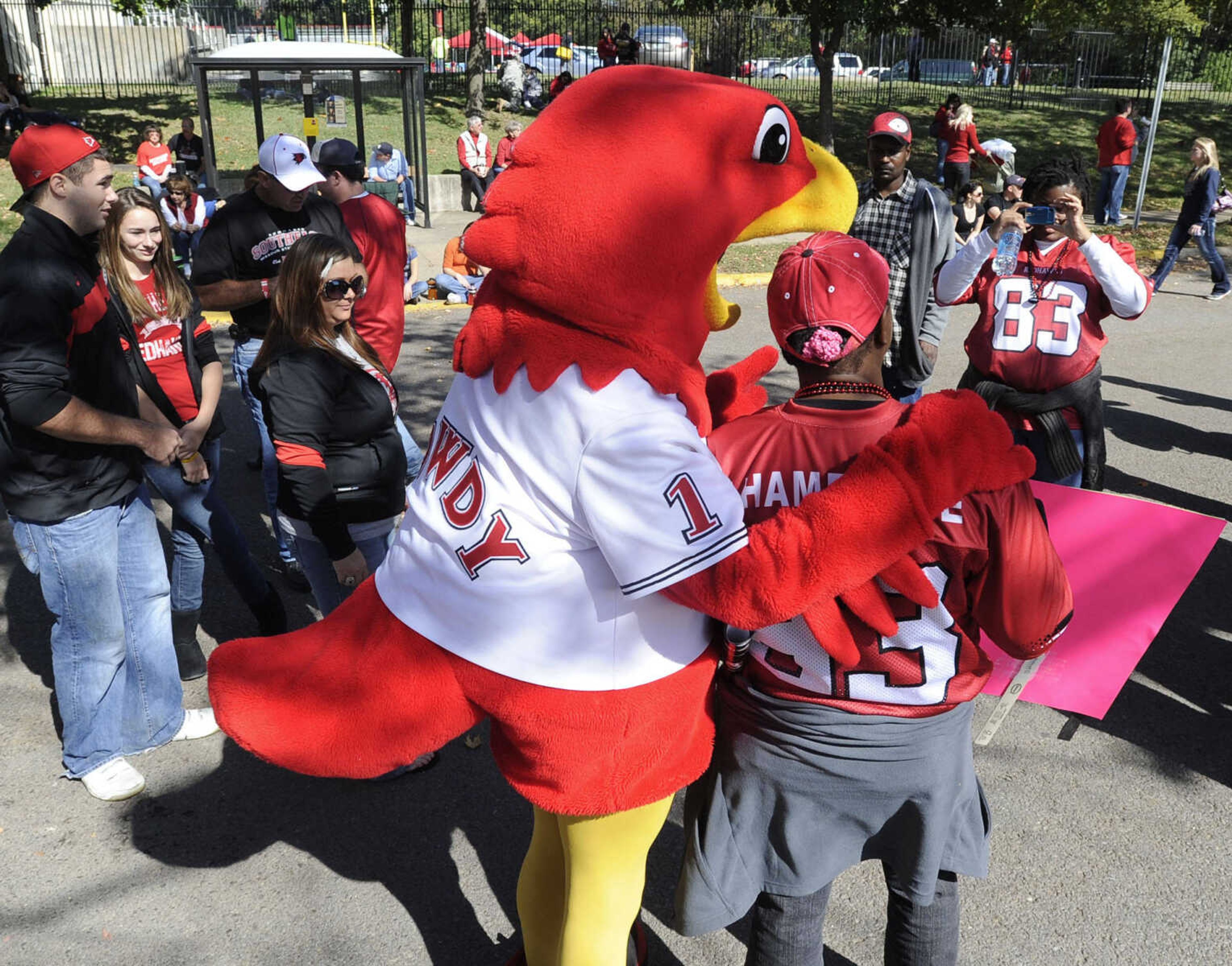 Rowdy Redhawk poses for pictures before the football game.