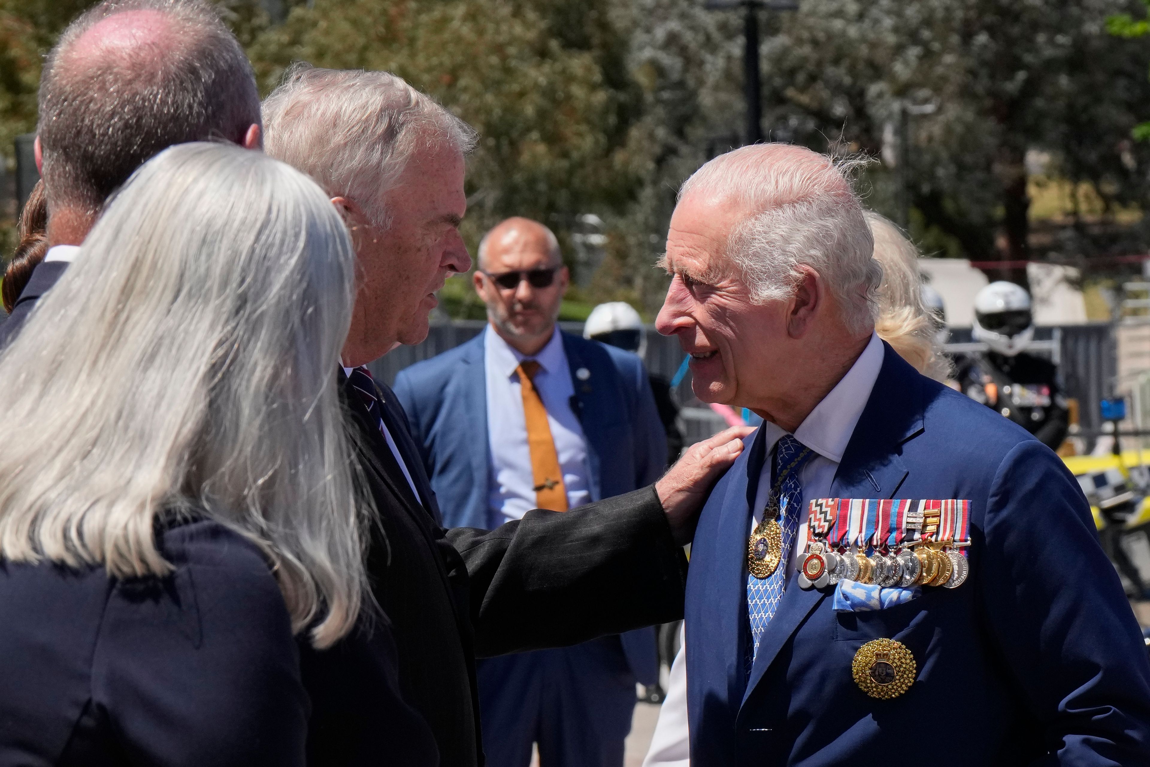 Kim Beazley, third left, chair of Australian War Memorial Council, meets Britain's King Charles III, right, on the king's arrival with Queen Camilla in Canberra, Australia, Monday, Oct. 21, 2024.