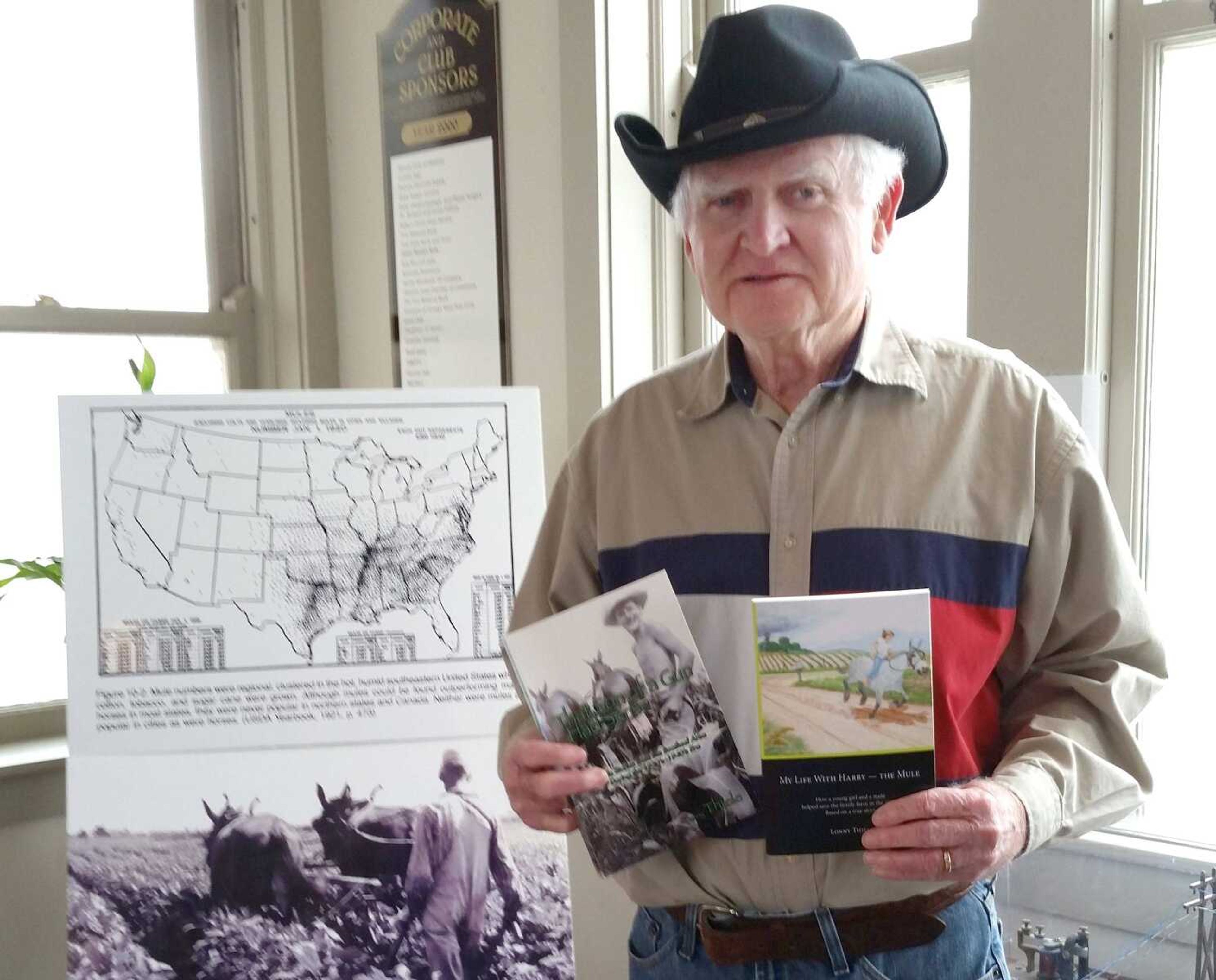 Lonny Thiele poses with copies of his books, "That Son of a Gun Had Sense" and "My Life with Harry -- The Mule." (Photo submitted by Lonny Thiele)