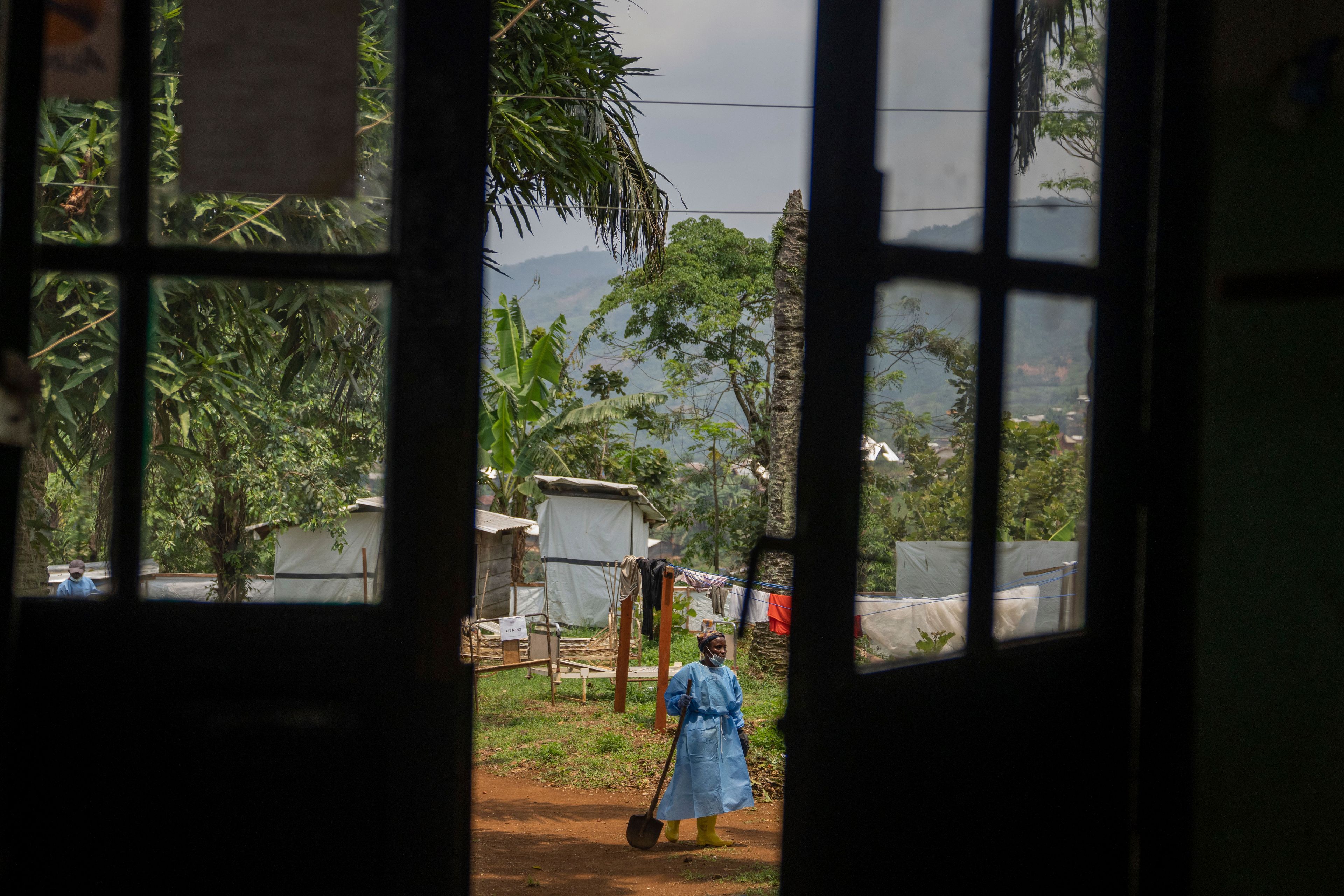 A worker carries a shovel at the hospital in Kamituga, in South Kivu province in eastern Congo on Sept. 4, 2024. South Kivu is considered the epicenter of the world's latest outbreak of mpox. (AP Photo/Moses Sawasawa)