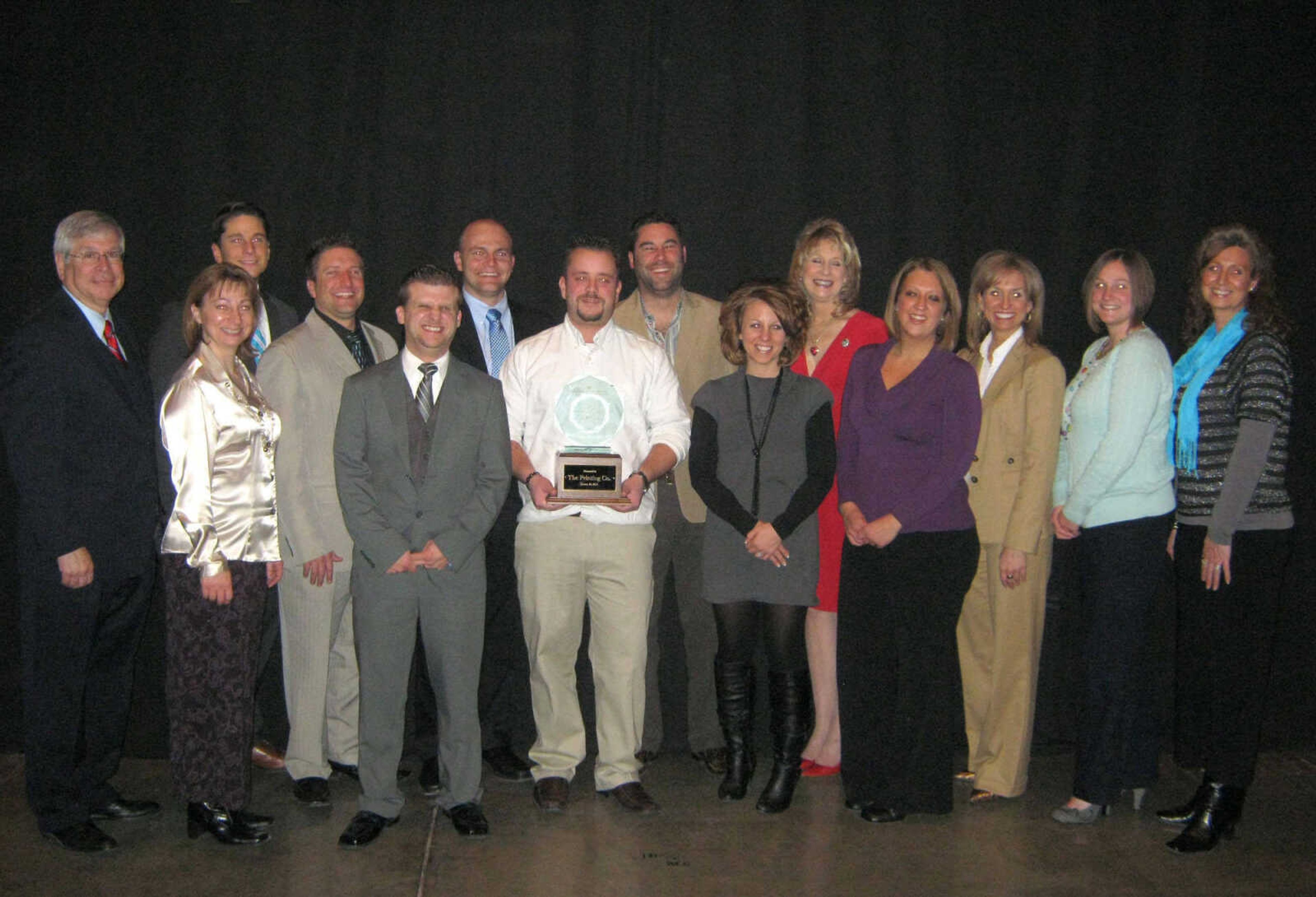 The Printing Co. received the Small Business of the Year Award. From left: Sen. Wayne Wallingford, R-Cape Girardeau; Brenda Kluesner, Mike Strom, Bryan Welker, Mike Dudek, David Likens, Matt Torbet, Jason Coalter, Jennifer Lauck, Rep. Kathy Swan, R-Cape Girardeau;  Madeline Clements, Rep. Shelley Keeney R-Marble Hill; Amanda Hill and Karen Neal.