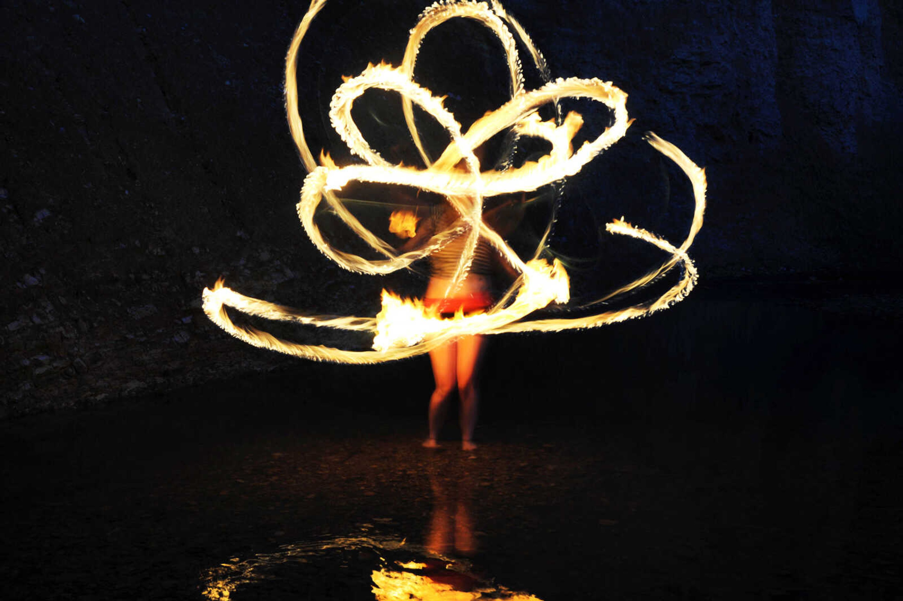 LAURA SIMON ~ lsimon@semissourian.com

Chelsie Welker fire hoops in a Cape Girardeau County creek, Tuesday, May 26, 2015.