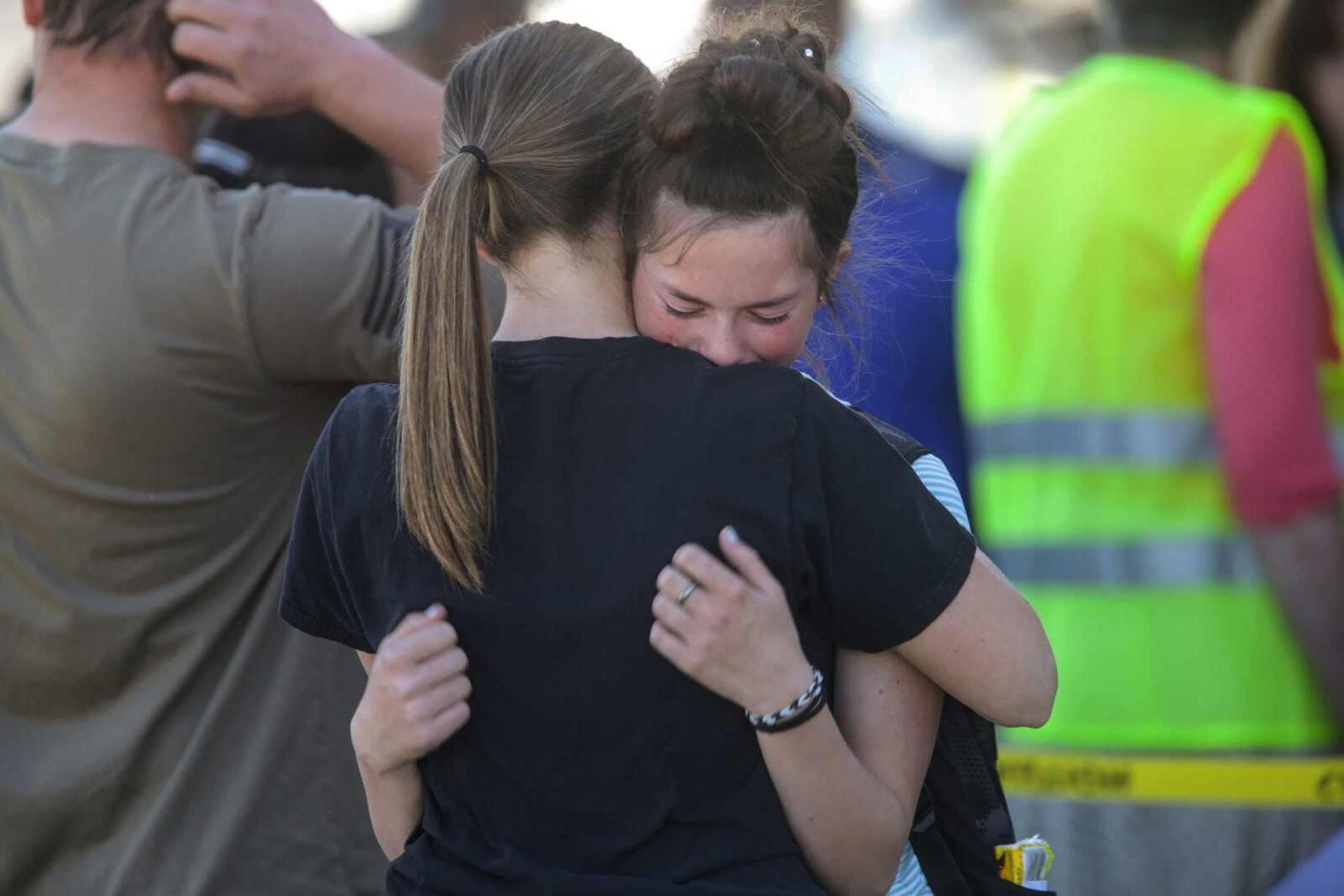 Students embrace after a school shooting at Rigby Middle School on Thursday in Rigby, Idaho.