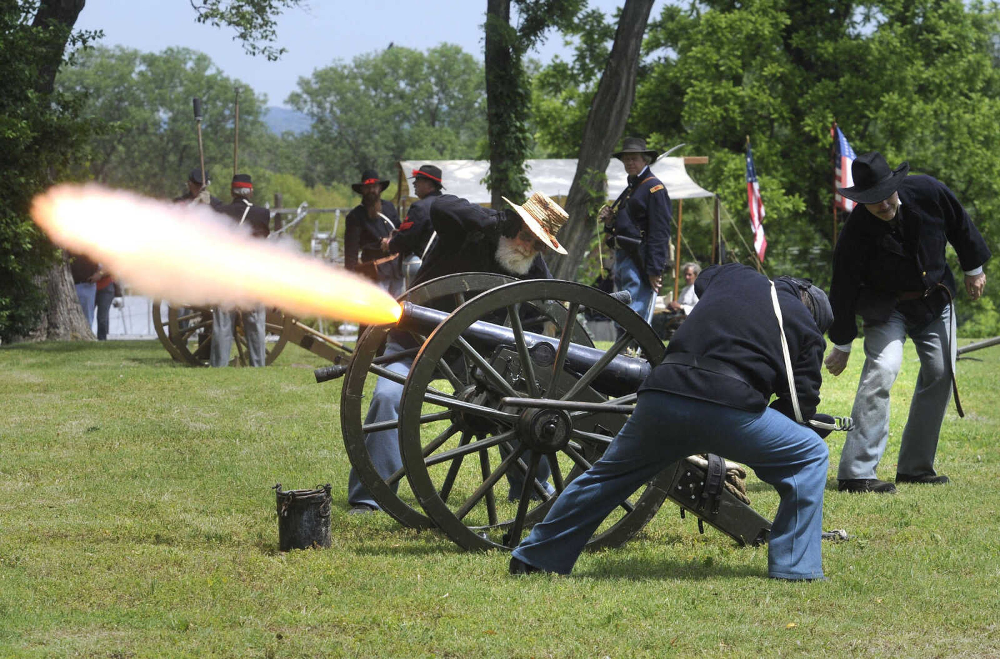 FRED LYNCH ~ flynch@semissourian.com
Members of The Turner Brigade fire a cannon in the reenactment of the Battle of Cape Girardeau during Fort D Days on Saturday, May 25, 2013 in Cape Girardeau.