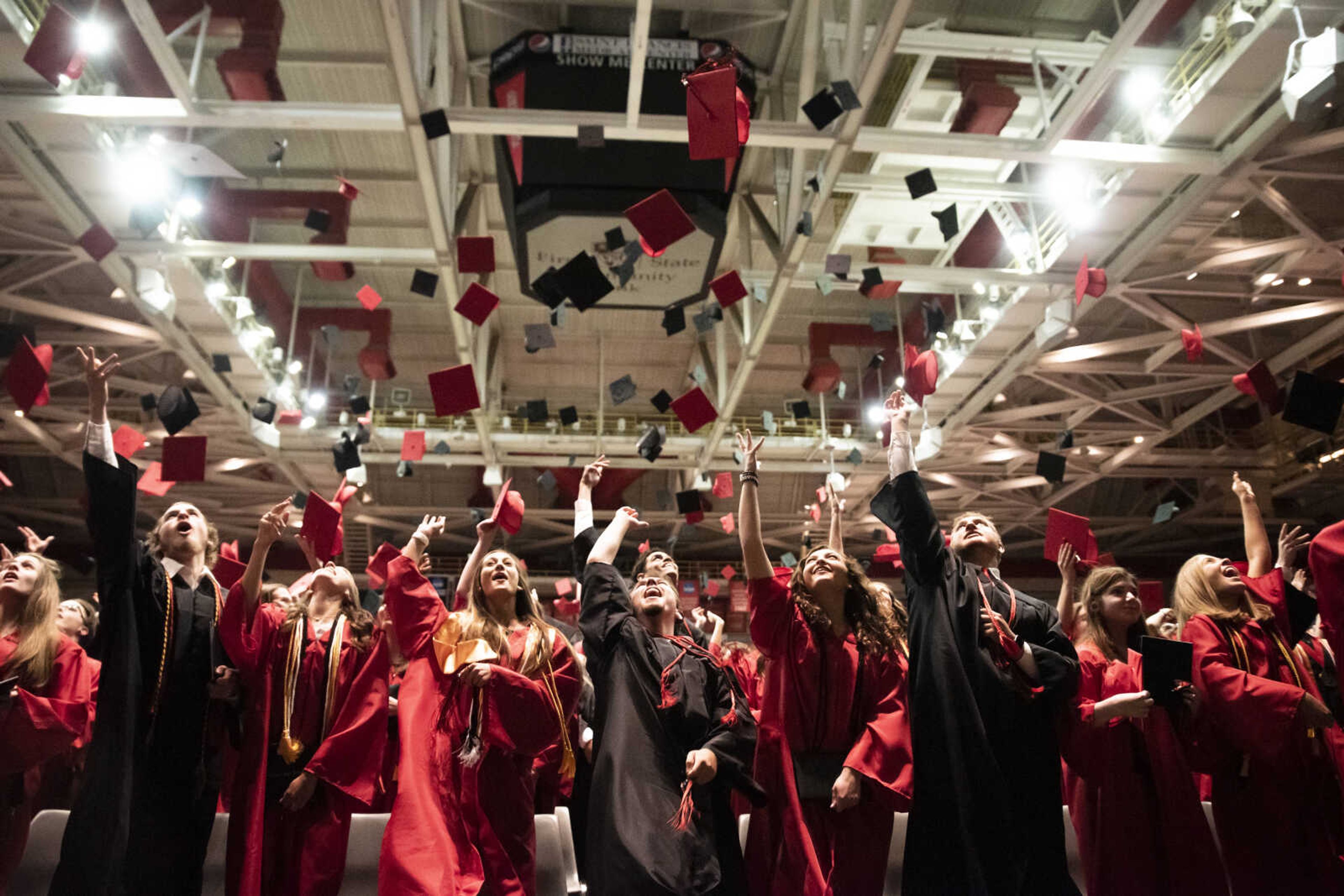 Graduates of Jackson High School's Class of 2019 throw their caps in the air after becoming official high school graduates at the conclusion of the commencement ceremony at the Show Me Center Friday, May 24, 2019, in Cape Girardeau.