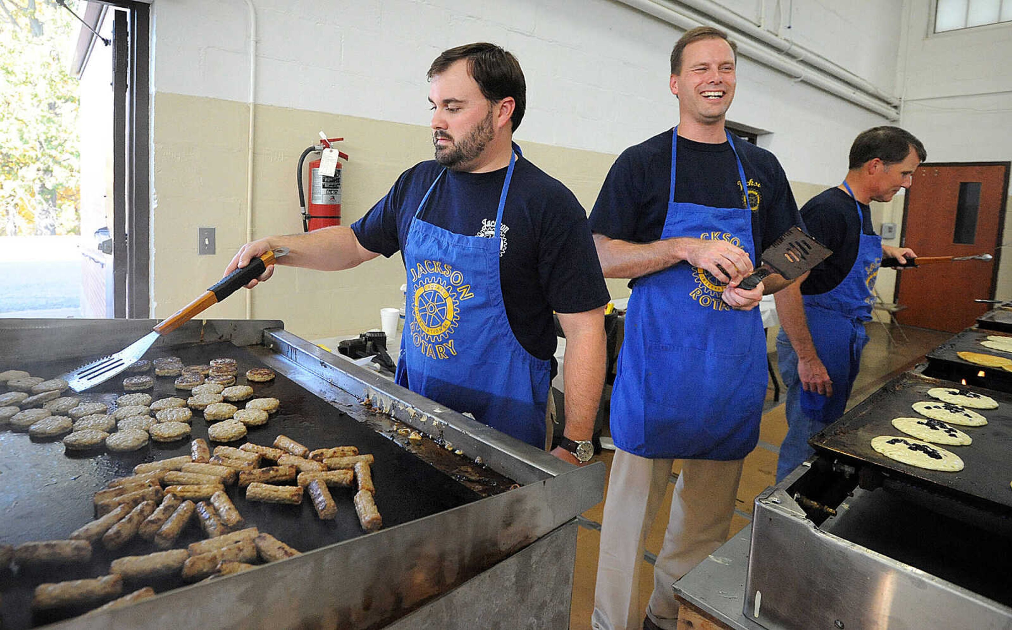 LAURA SIMON ~ lsimon@semissourian.com
Rotarians Brandon Pylate, left, Tim Walker and Doug Mueller man the griddles Tuesday, Oct. 23, 2012 during the Jackson Rotary Pancake Day at the National Guard Armory.