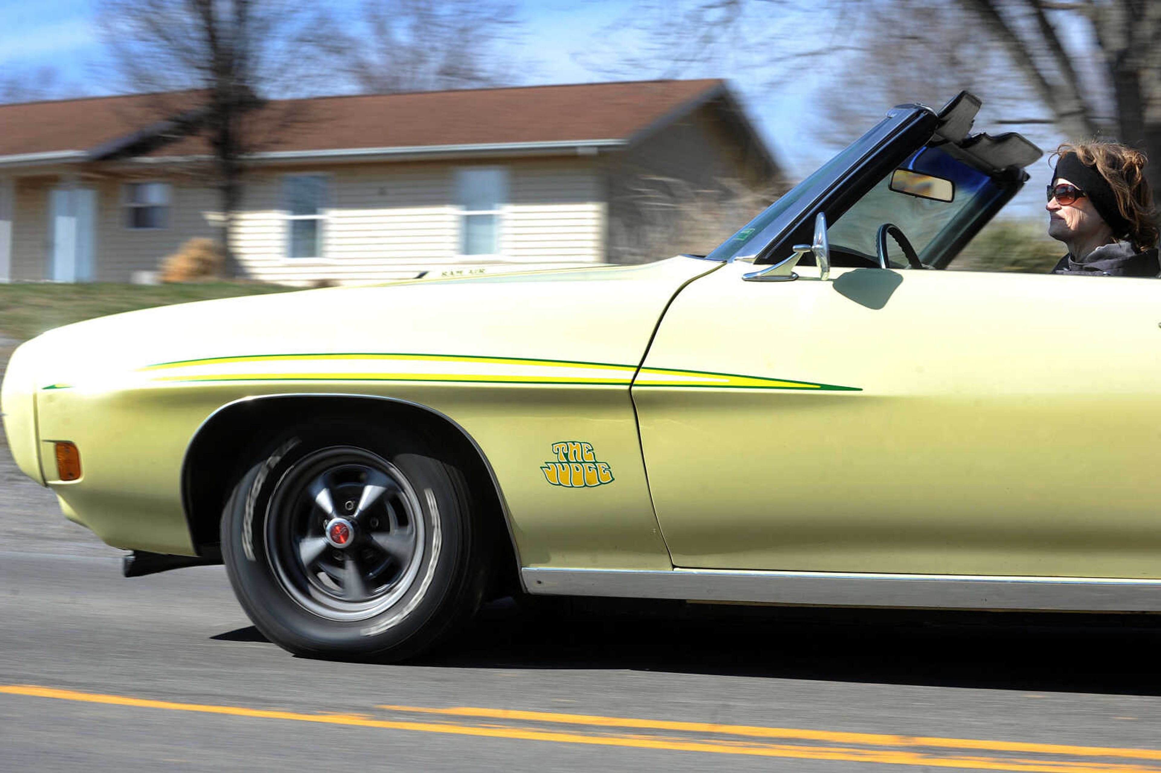 Lana Arnzen takes a drive in the 1970 Pontiac GTO Judge convertible she and her husband bought in 1975. (Laura Simon)