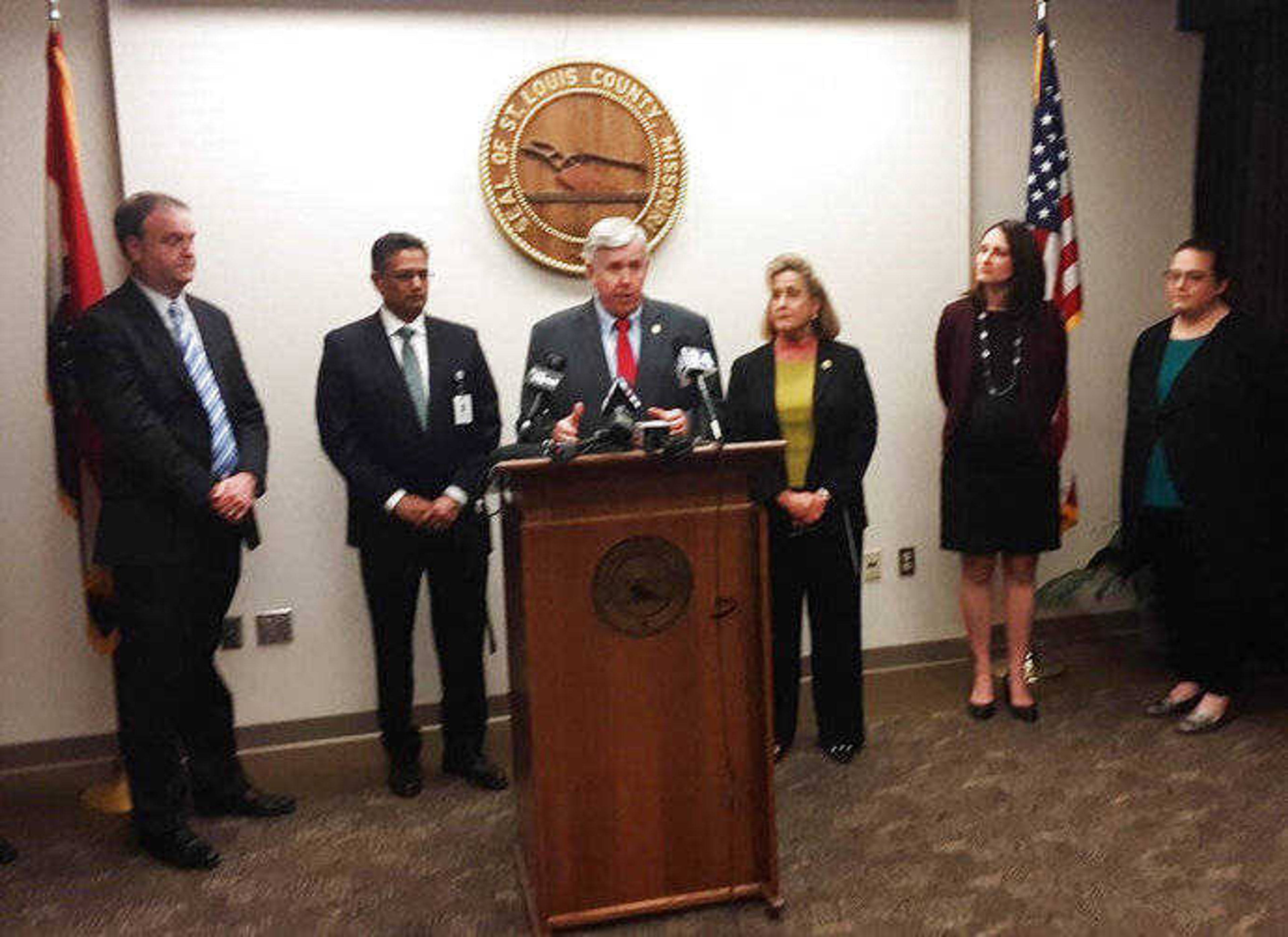 Gov. Mike Parson speaks during a news conference in St. Louis on Saturday, March 7, 2020. A St. Louis-area woman who recently traveled to Italy is Missouri's first confirmed coronavirus case, officials said Saturday. The woman is in her 20s and is at home with her parents, St. Louis County Executive Sam Page, a physician, said during a news conference with the governor. She was returning home from Italy when she showed symptoms. (Colleen Schrappen/St. Louis Post-Dispatch via AP)