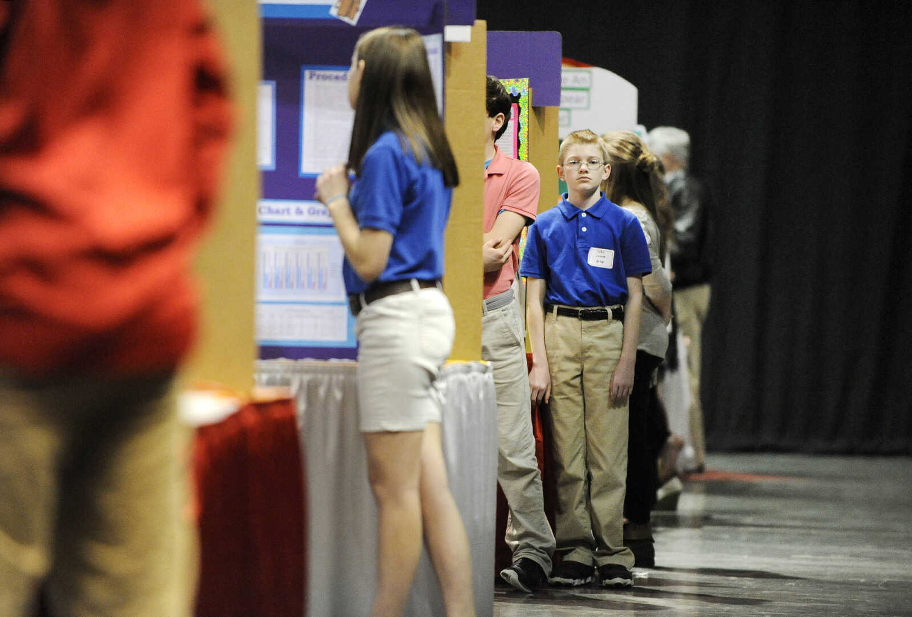 LAURA SIMON ~ lsimon@semissourian.com

Luke Lovett from St. Dennis in Benton, Missouri, waits next to his science fair project, Tuesday, March 8, 2016, during the 2016 Southeast Missouri Regional Science Fair at the Show Me Center.