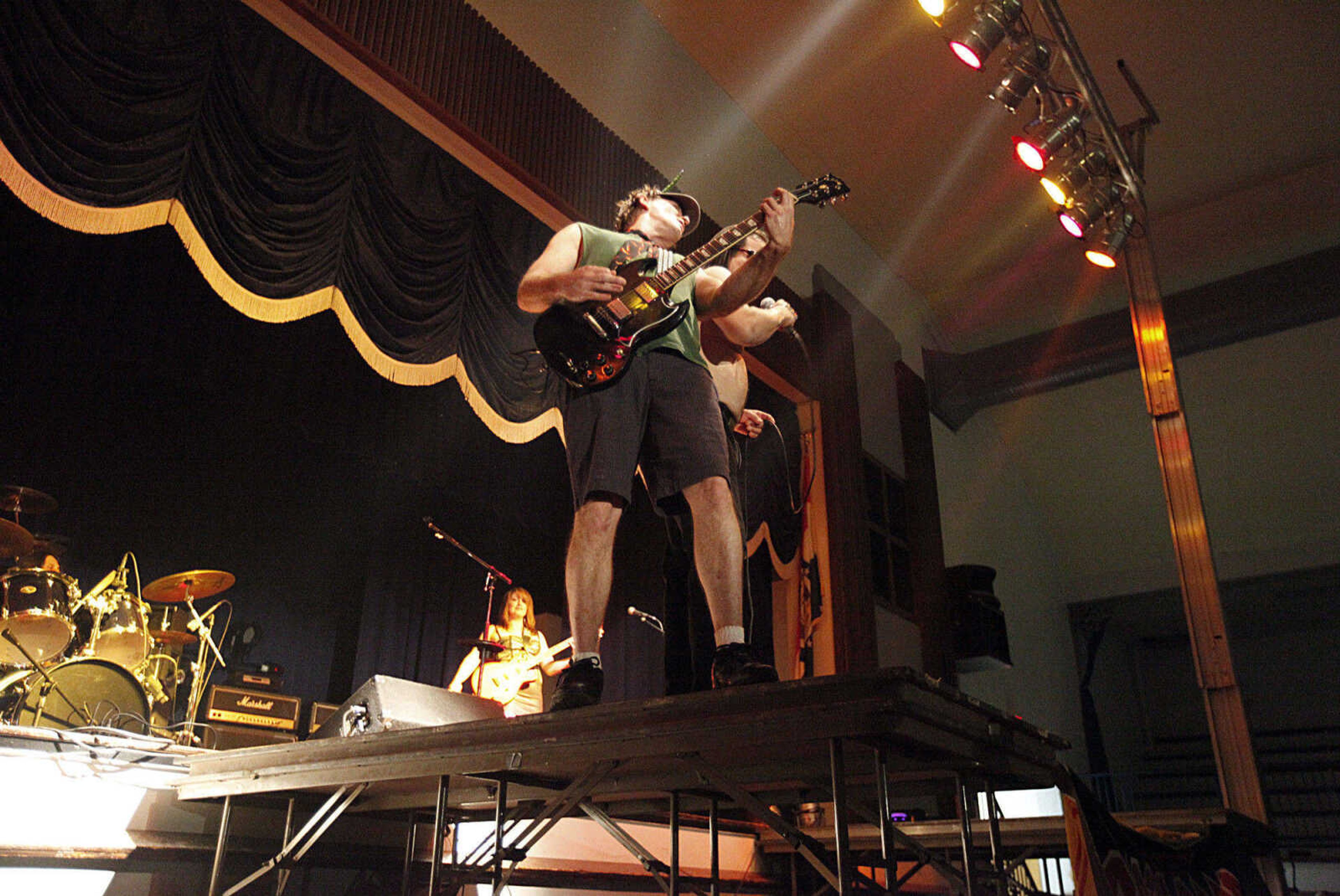 CHRIS MACKLER ~ photos@semissourian.com

Dirty Deeds, a tribute to AC/DC, performs during the Kiss, AC/DC and Rod Stewart Tribute Concert held at the Arena Building on Saturday, Nov. 6, 2010 in Cape Girardeau.