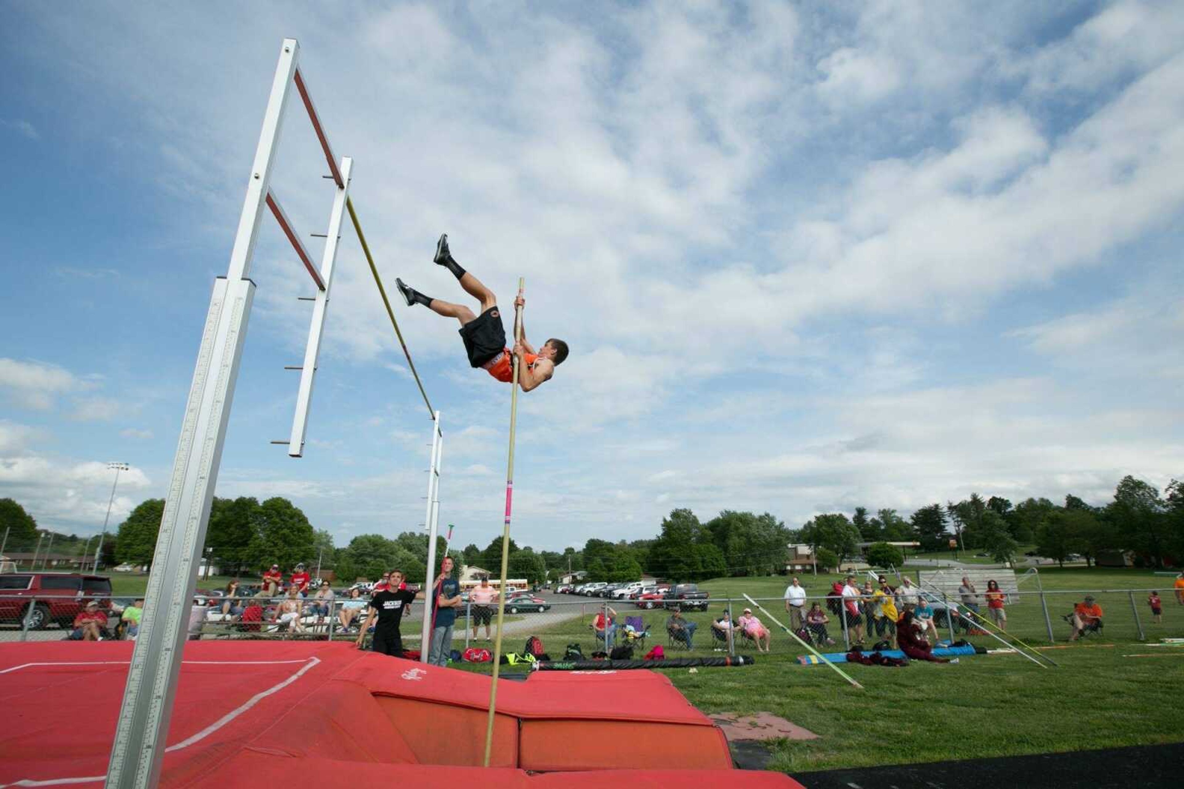 Cape Central's Cyrus Woolard works his way over the bar in the pole vault during the SEMO Conference North track and field meet Friday, May 8, 2015 in Jackson. (Glenn Landberg)