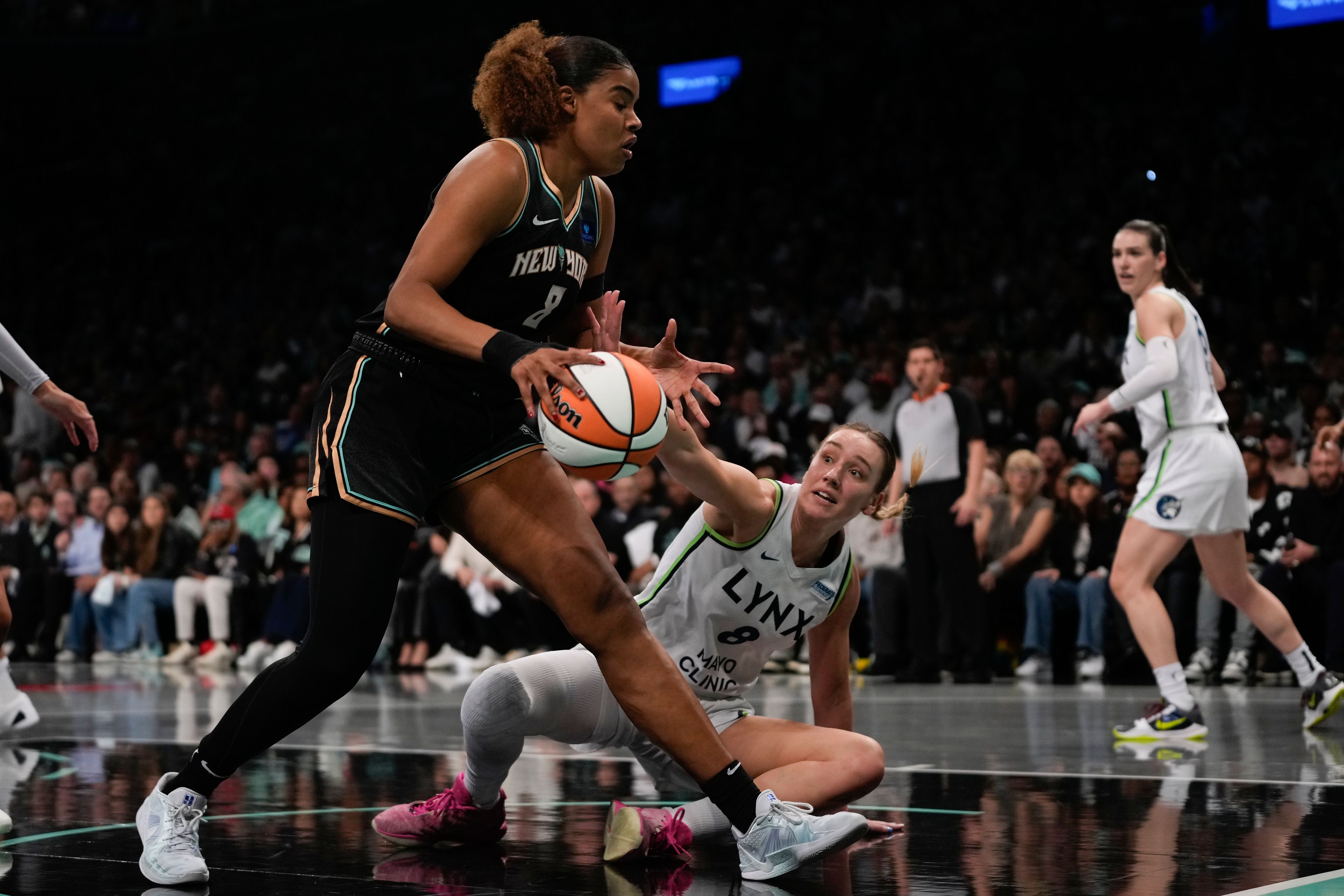 New York Liberty forward Nyara Sabally (8) grabs control of a rebound against Minnesota Lynx forward Alanna Smith (8) during the first quarter of Game 5 of the WNBA basketball final series, Sunday, Oct. 20, 2024, in New York. (AP Photo/Pamela Smith)