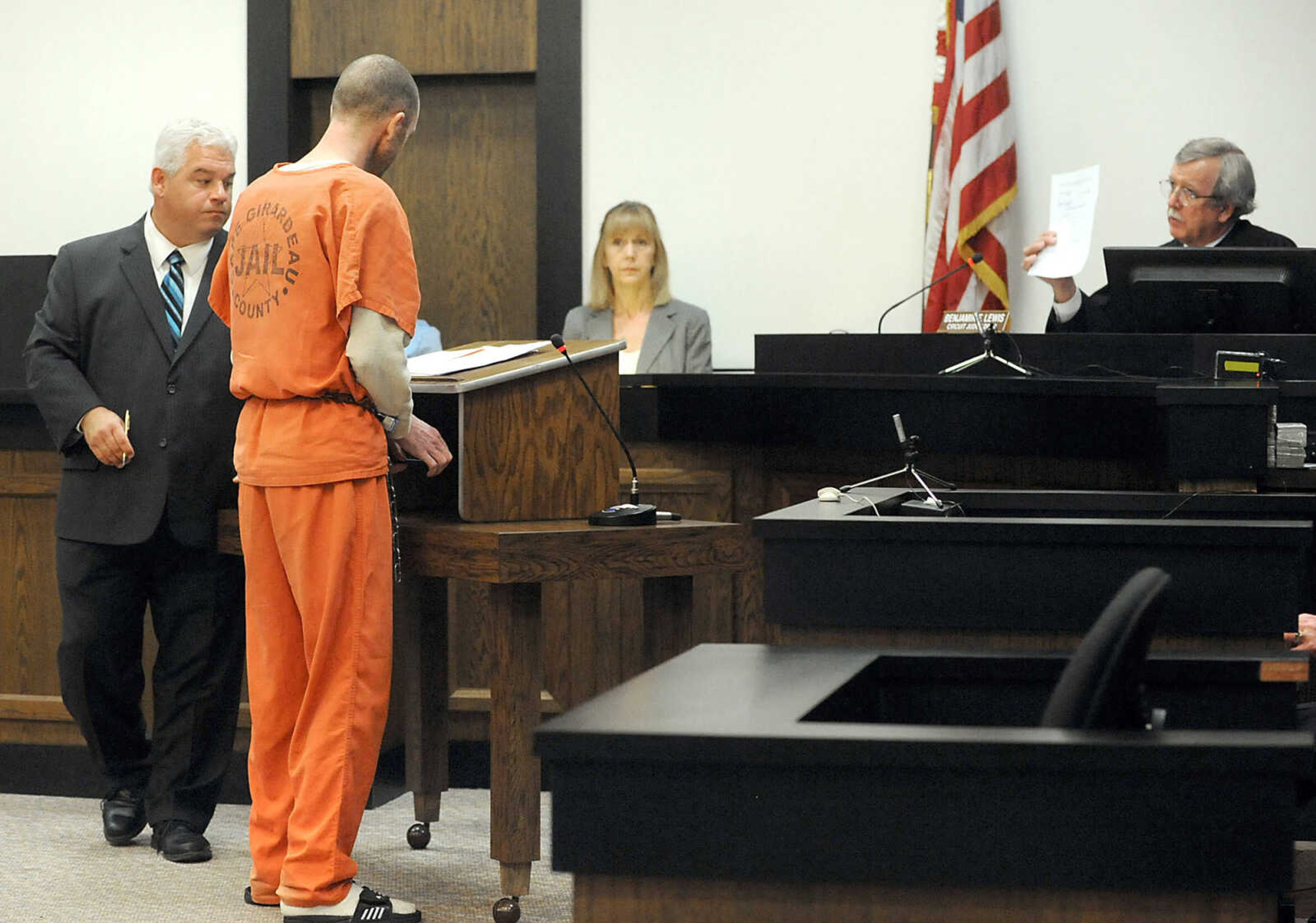 LAURA SIMON ~ lsimon@semissourian.com 
Cape Girardeau County Circuit Judge Ben Lewis verifies Clay Waller's signature on his plea agreement, Thursday, June 6, 2013, at the Cape Girardeau County Courthouse. Waller pleaded guilty to second-degree murder for the death of his wife, Jacque Waller. Jacque Waller went missing June 1, 2011. Her body was found last Wednesday in Southern Illinois.