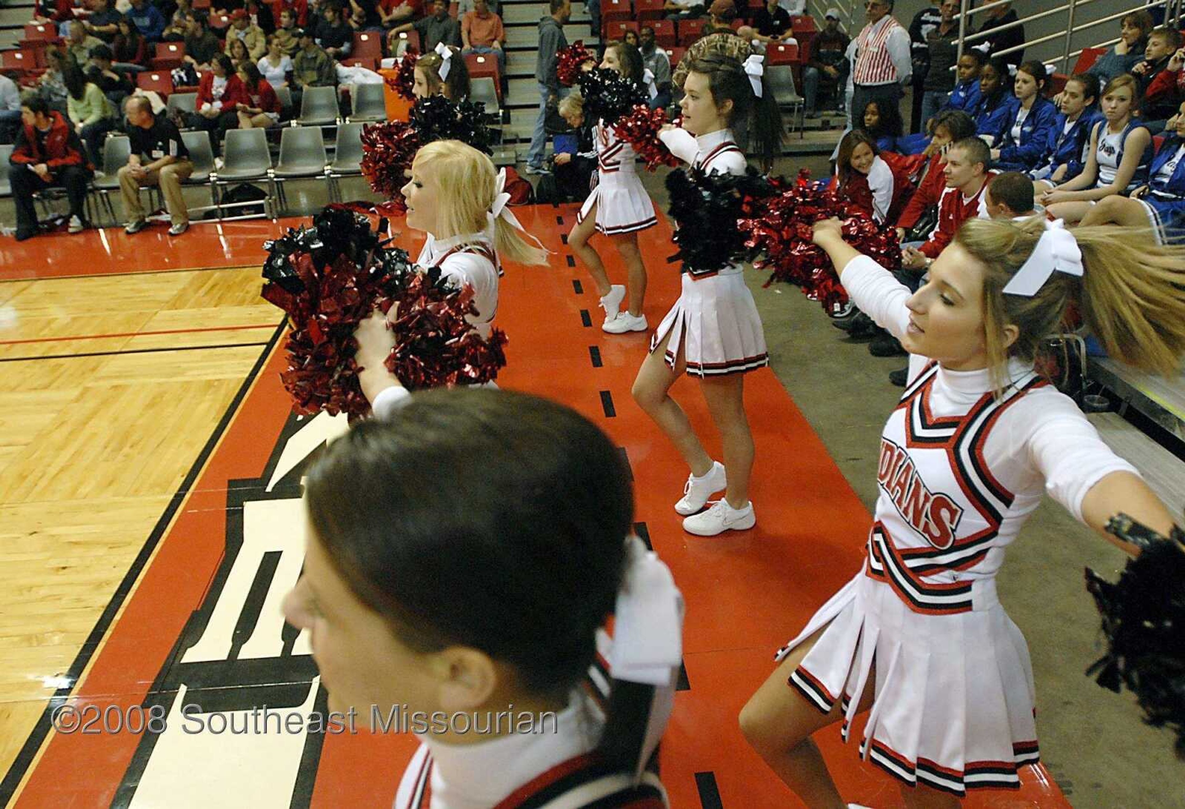 KIT DOYLE ~ kdoyle@semissourian.com
Jackson cheerleaders encourage the Indians Monday, December 29, 2008, during the Southeast Missourian Christmas Tournament at the Show Me Center.