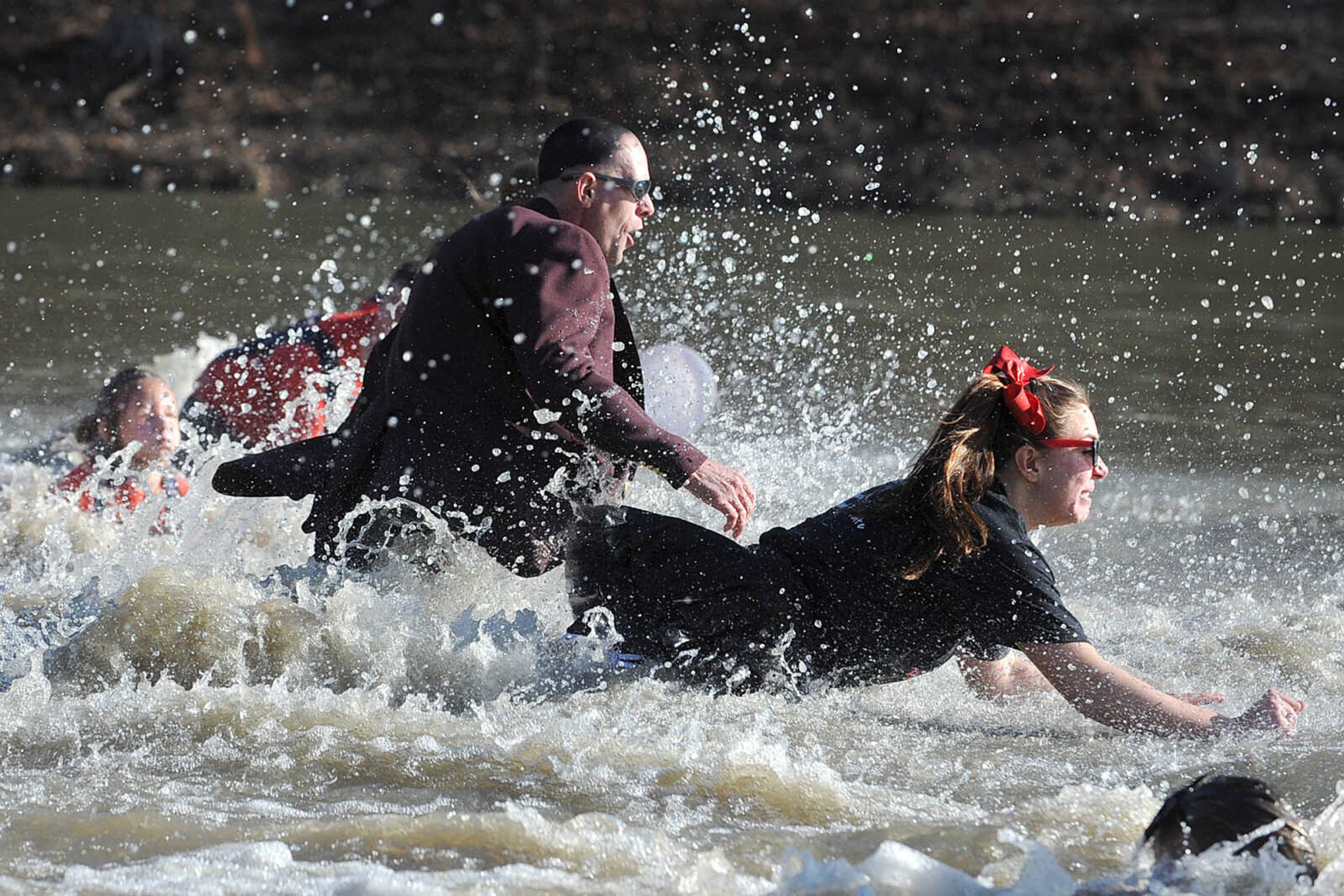 LAURA SIMON ~ lsimon@semissourian.com
People plunge into the cold waters of Lake Boutin Saturday afternoon, Feb. 2, 2013 during the Polar Plunge at Trail of Tears State Park. Thirty-six teams totaling 291 people took the annual plunge that benefits Special Olympics Missouri.