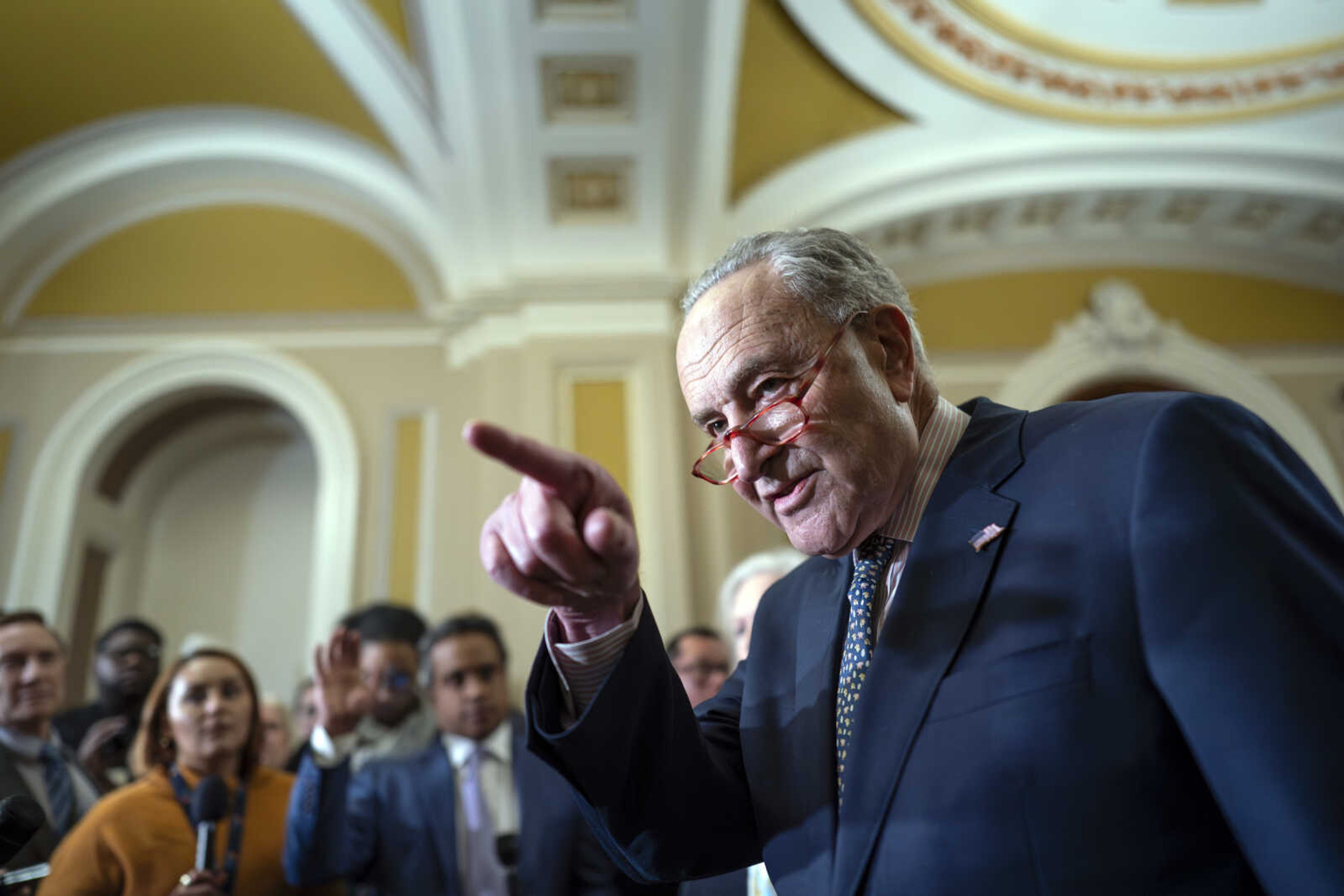 Senate Majority Leader Chuck Schumer, D-N.Y., speaks to reporters Tuesday at the Capitol in Washington. Wednesday, Schumer said the Senate will consider a resolution allowing the quick confirmation of nearly 400 military officers up for promotion or nominated, bypassing a hold by Sen. Tommy Tuberville.