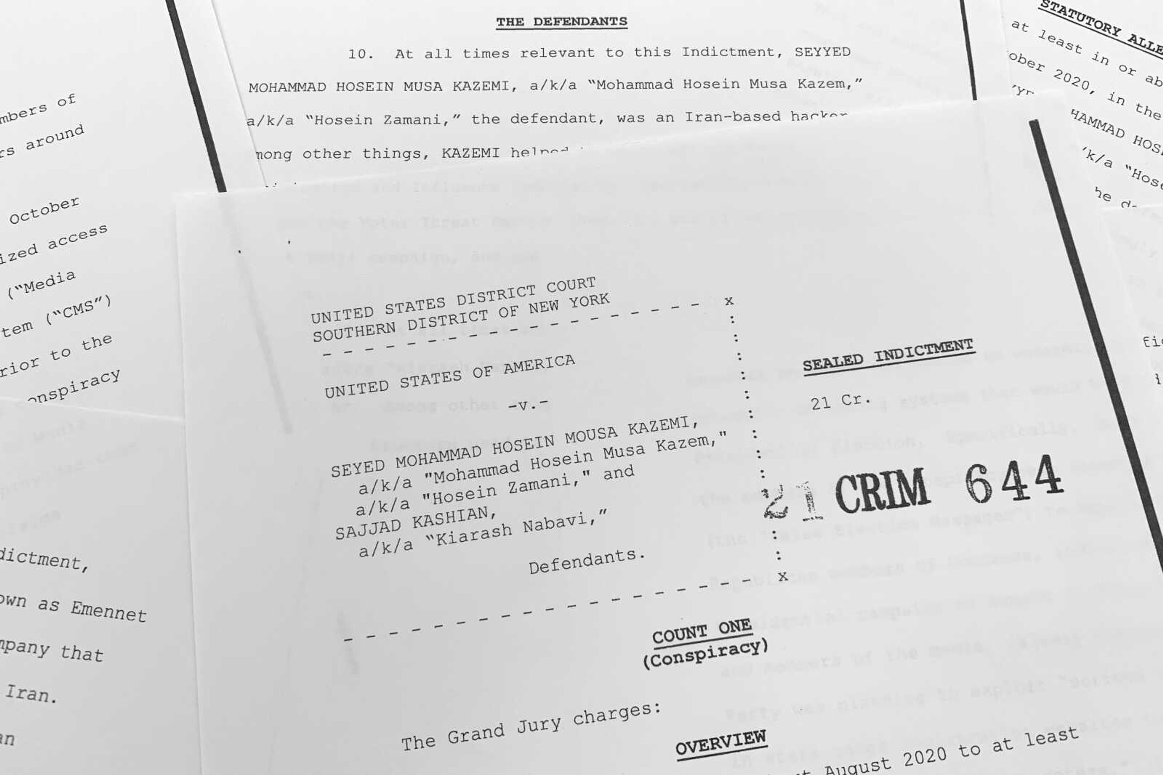 The grand jury indictment against Iranian nationals Seyyed Mohammad Hosein Musa Kazemi and Sajjad Kashian is photographed Thursday. The two suspected Iranian computer hackers have been charged with election interference, accused of trying to intimidate American voters ahead of last year's U.S. presidential election by sending threatening messages and spreading disinformation.