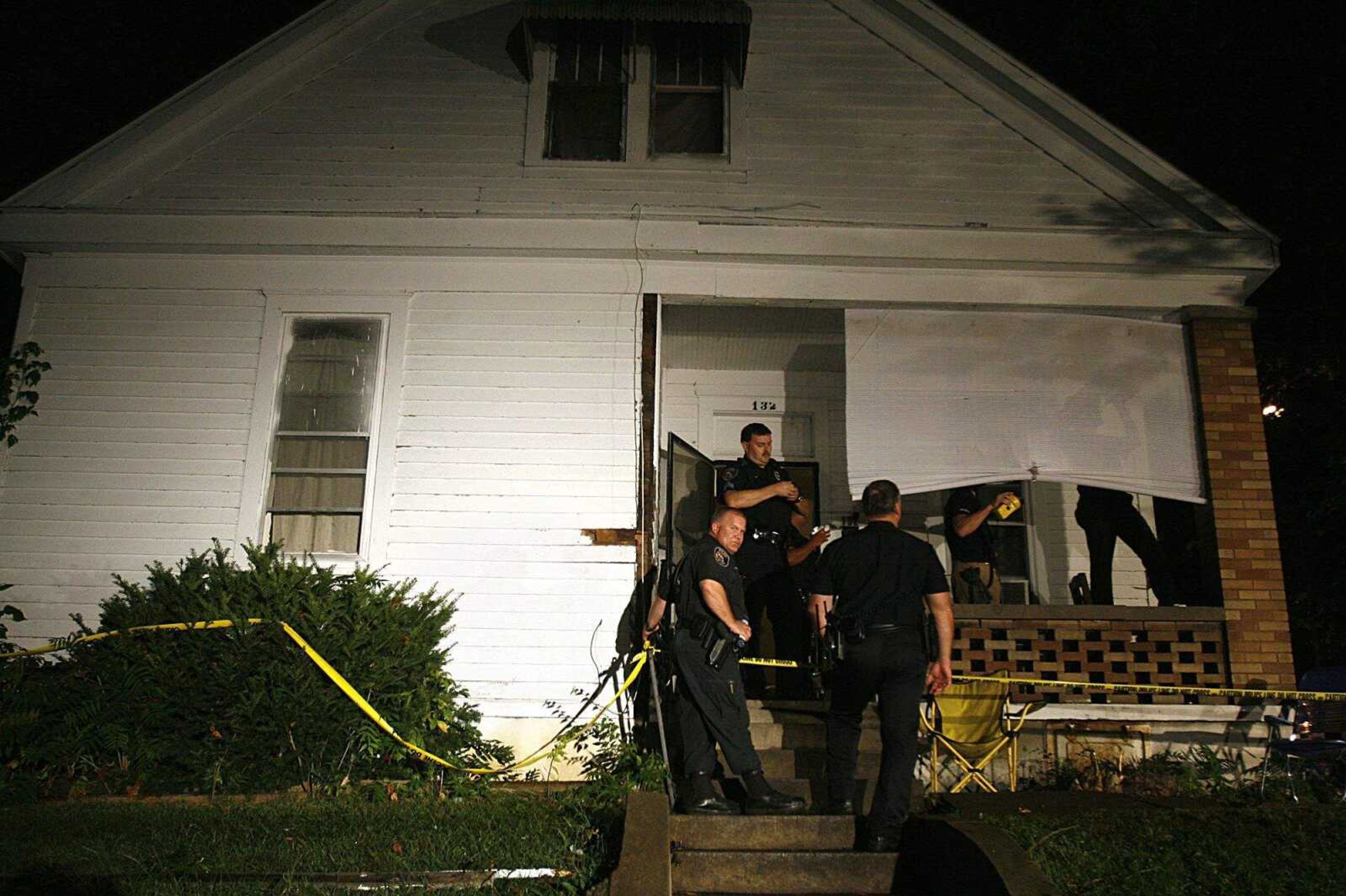 ELIZABETH DODD ~ edodd@semissourian.com
Officials from the Cape Girardeau Police Department gather evidence from the crime scene on Hanover St. after a shooting Wednesday night.