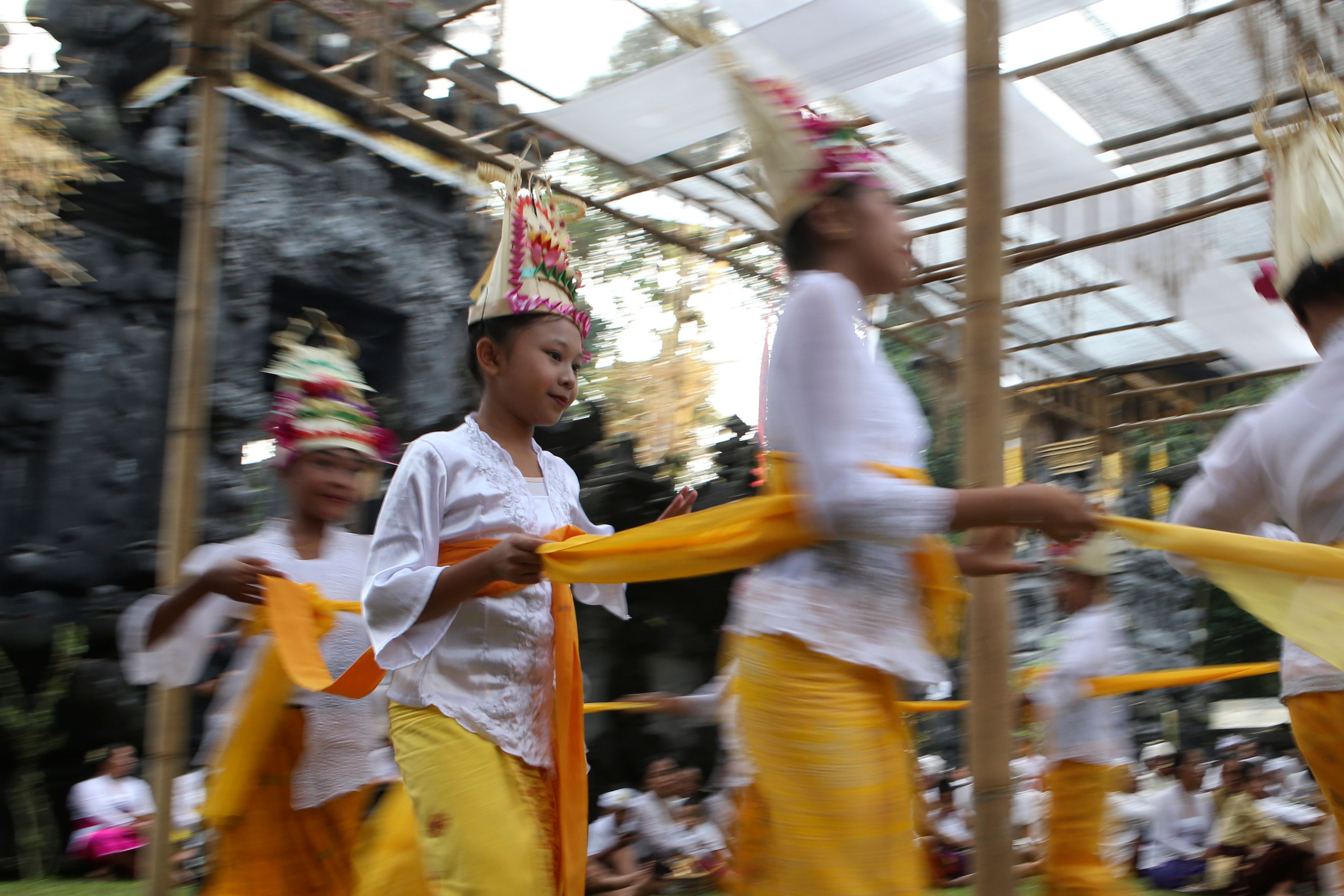 Ketut Nita Wahyuni, 11, performs the Rehang Dewa, a sacred Balinese dance, at Geriana Kauh village, Karangasem, Bali, Indonesia on Wednesday, Nov. 20, 2024. (AP Photo/Firdia Lisnawati)