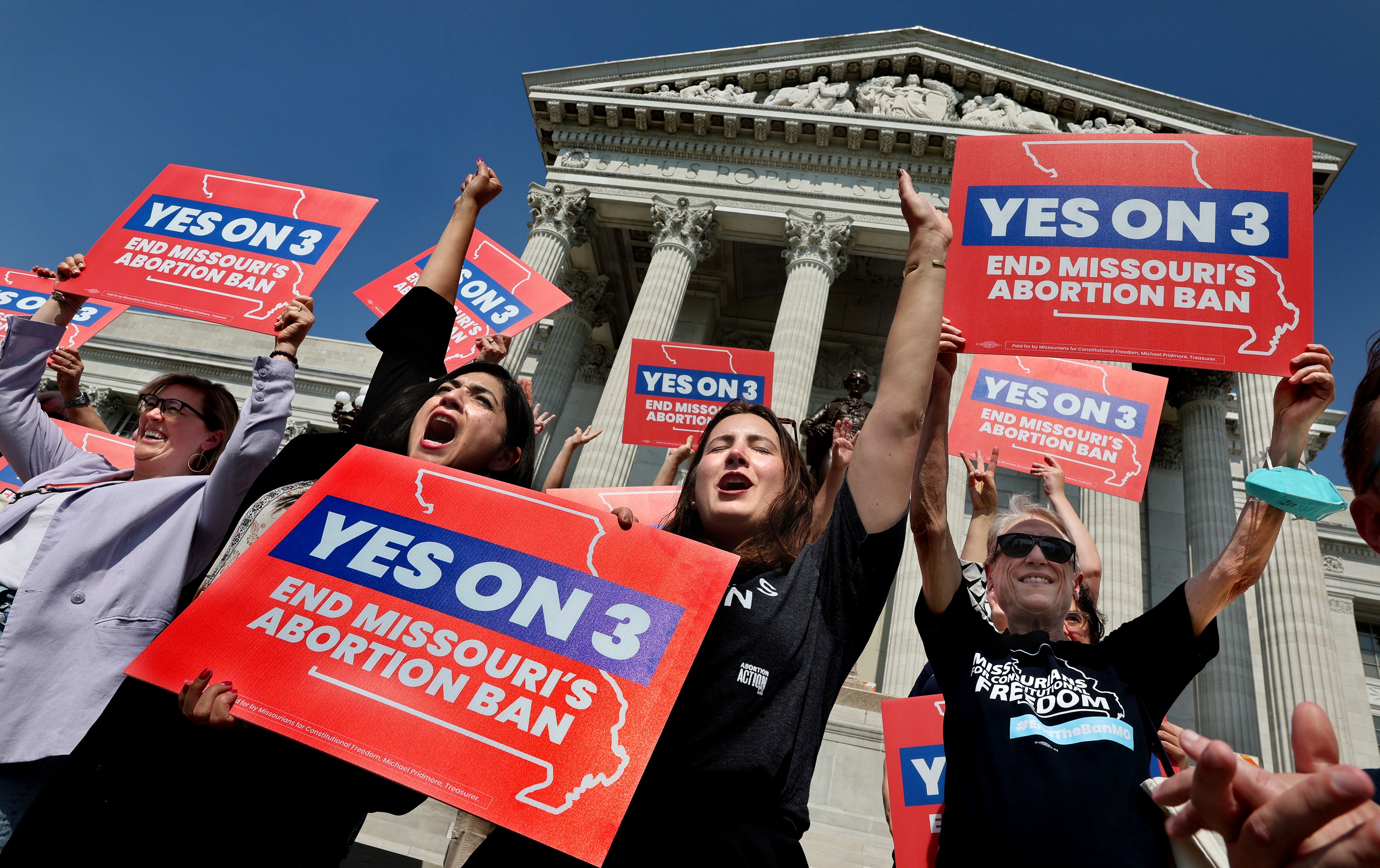 FILE - Amendment 3 supporters Luz Maria Henriquez, second from left, executive director of the ACLU Missouri, celebrates with Mallory Schwarz, center, of Abortion Action Missouri, after the Missouri Supreme Court in Jefferson City, Mo., ruled that the amendment to protect abortion rights would stay on the November ballot, Sept. 10, 2024. (Robert Cohen/St. Louis Post-Dispatch via AP, File)