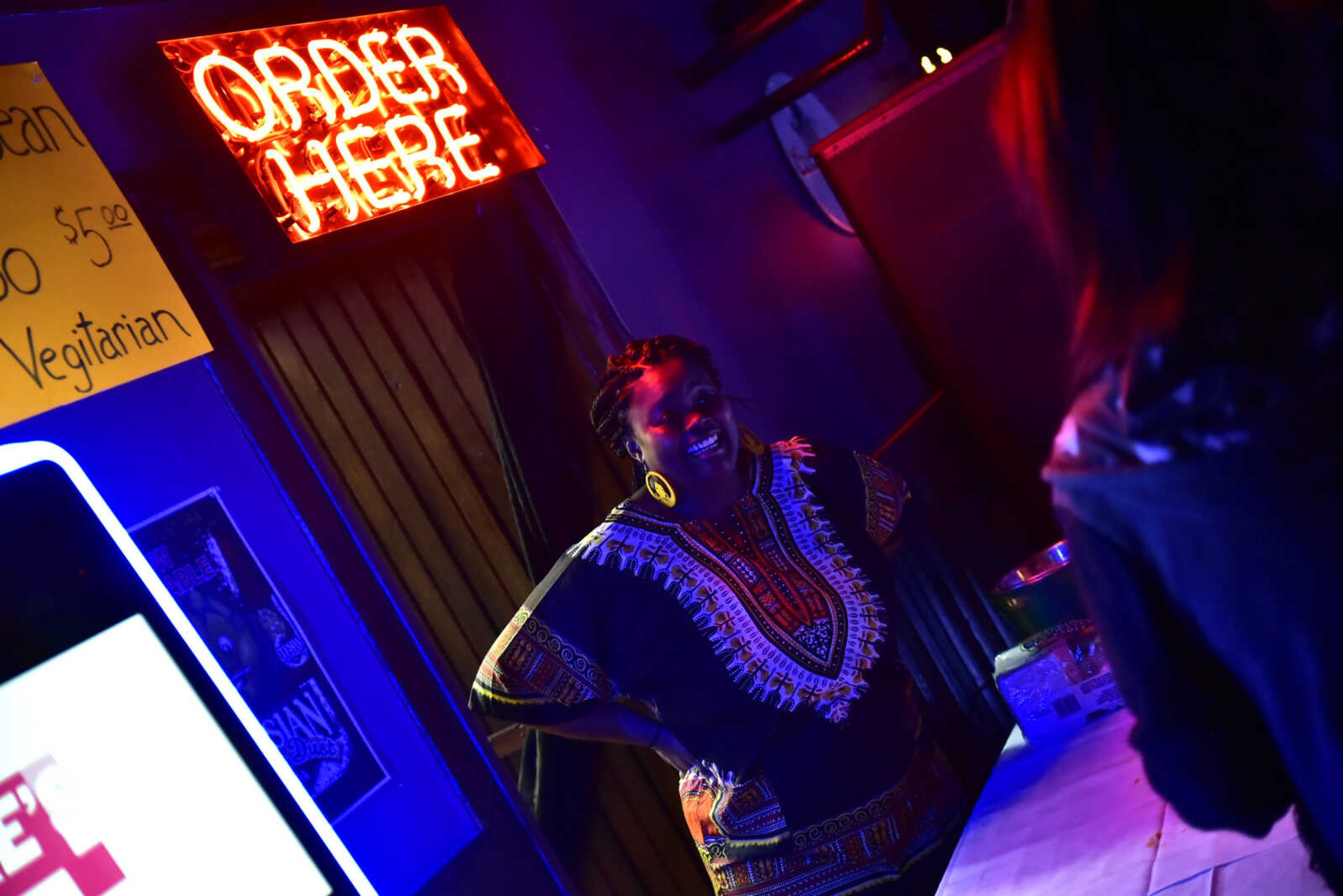 Michele Jackson talks with patrons at the 3rd annual Bob Marley Day celebration held at Ragsdales in downtown Cape Girardeau Feb. 10, 2018.