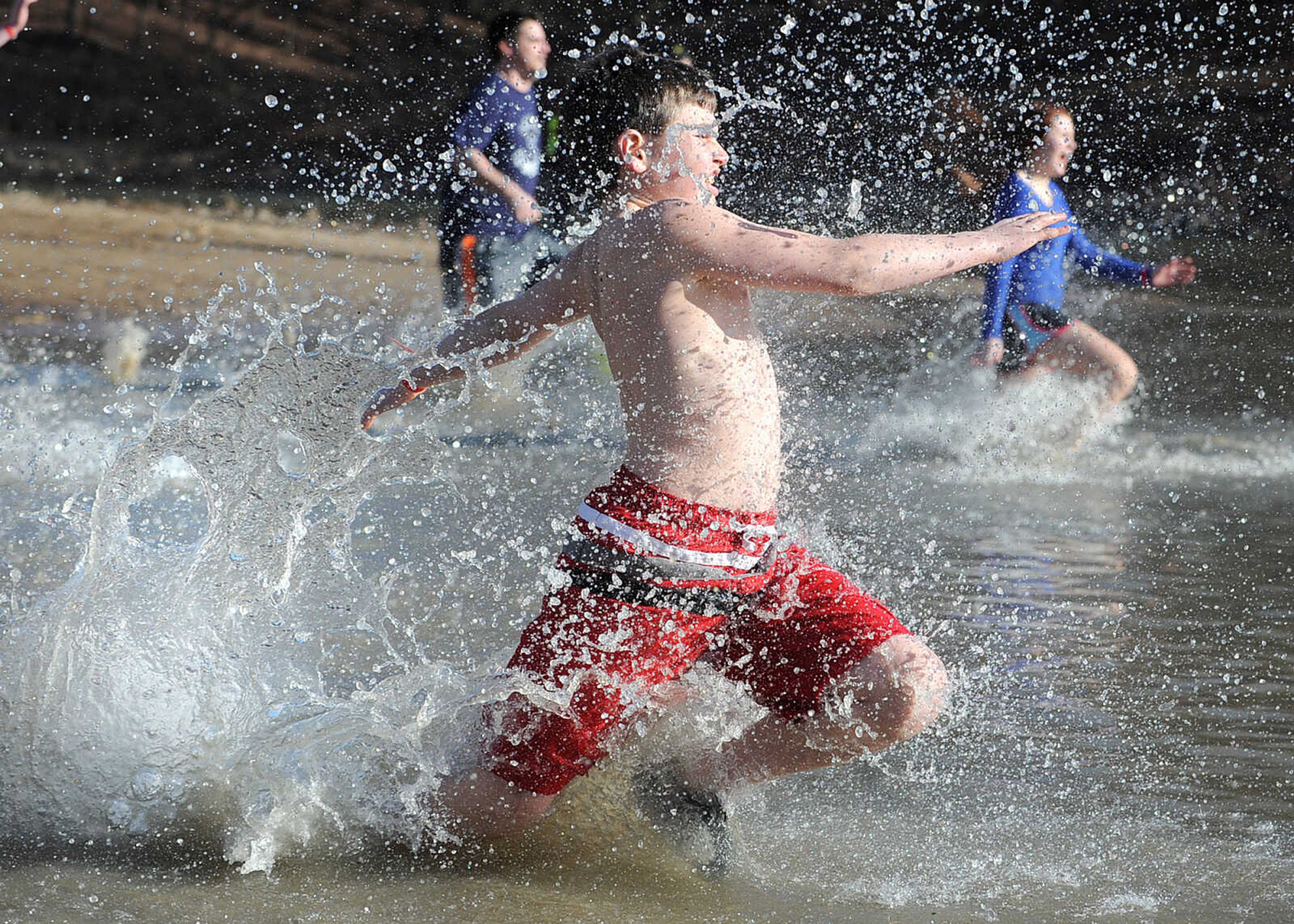 LAURA SIMON ~ lsimon@semissourian.com
People plunge into the cold waters of Lake Boutin Saturday afternoon, Feb. 2, 2013 during the Polar Plunge at Trail of Tears State Park. Thirty-six teams totaling 291 people took the annual plunge that benefits Special Olympics Missouri.