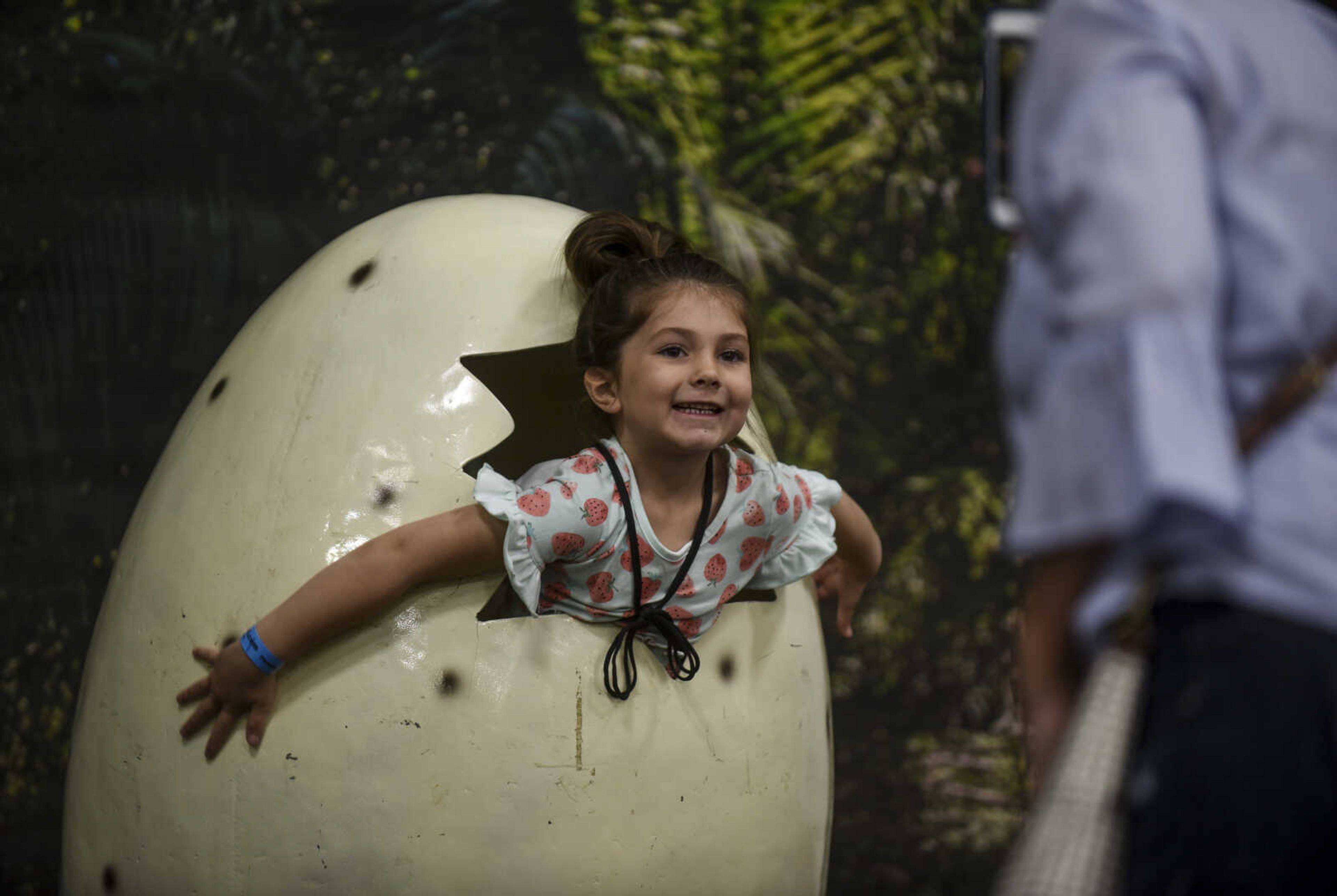 Hannah Thies, 5, smiles for a photo taken by her mother at Jurassic Quest Friday, April 27, 2018, at the Show Me Center in Cape Girardeau.